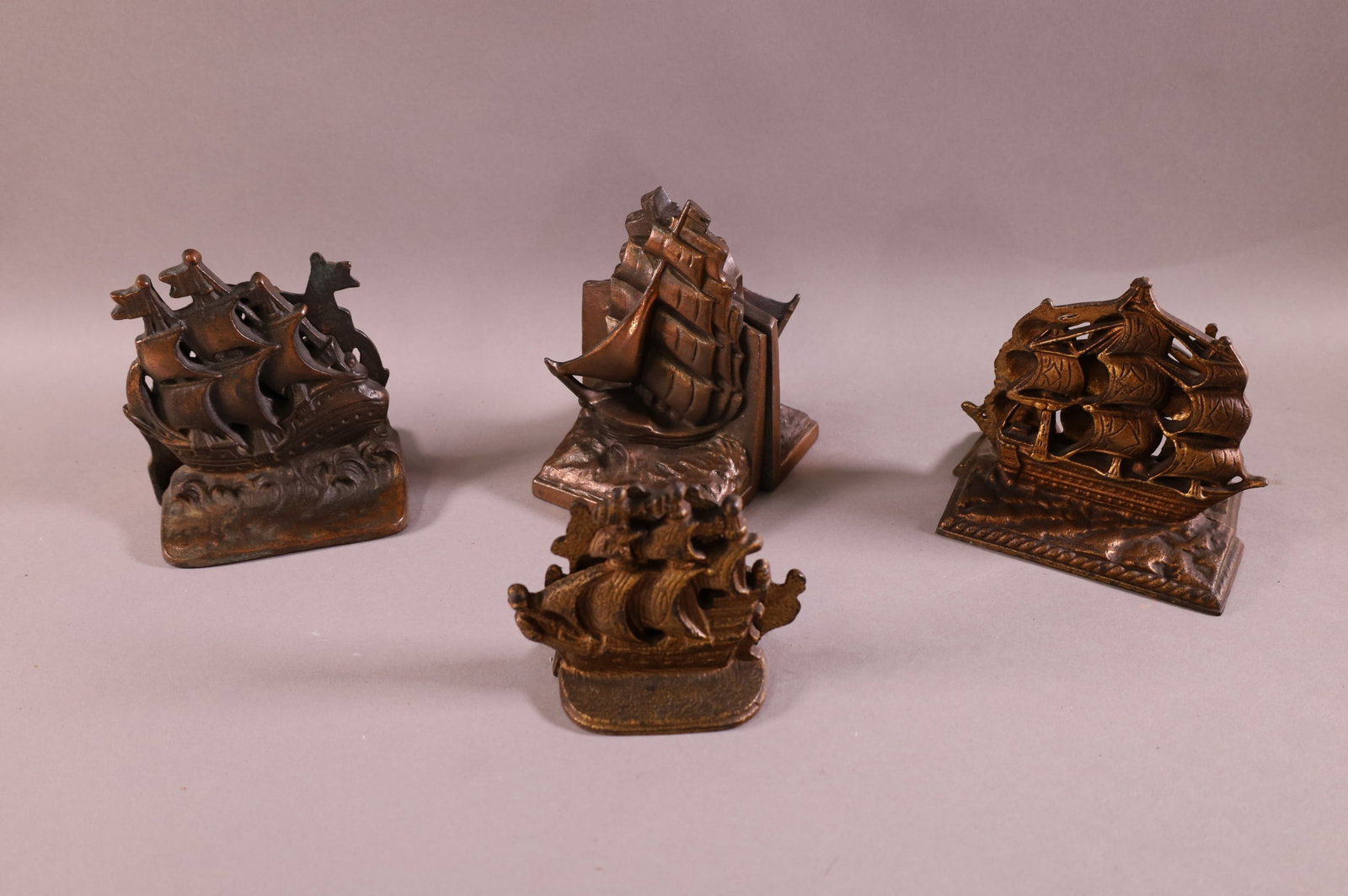 4 PAIRS OF METAL SHIP BOOKENDS: SHIP RELATED BOOKENDS. 4 1/2" - 6" H