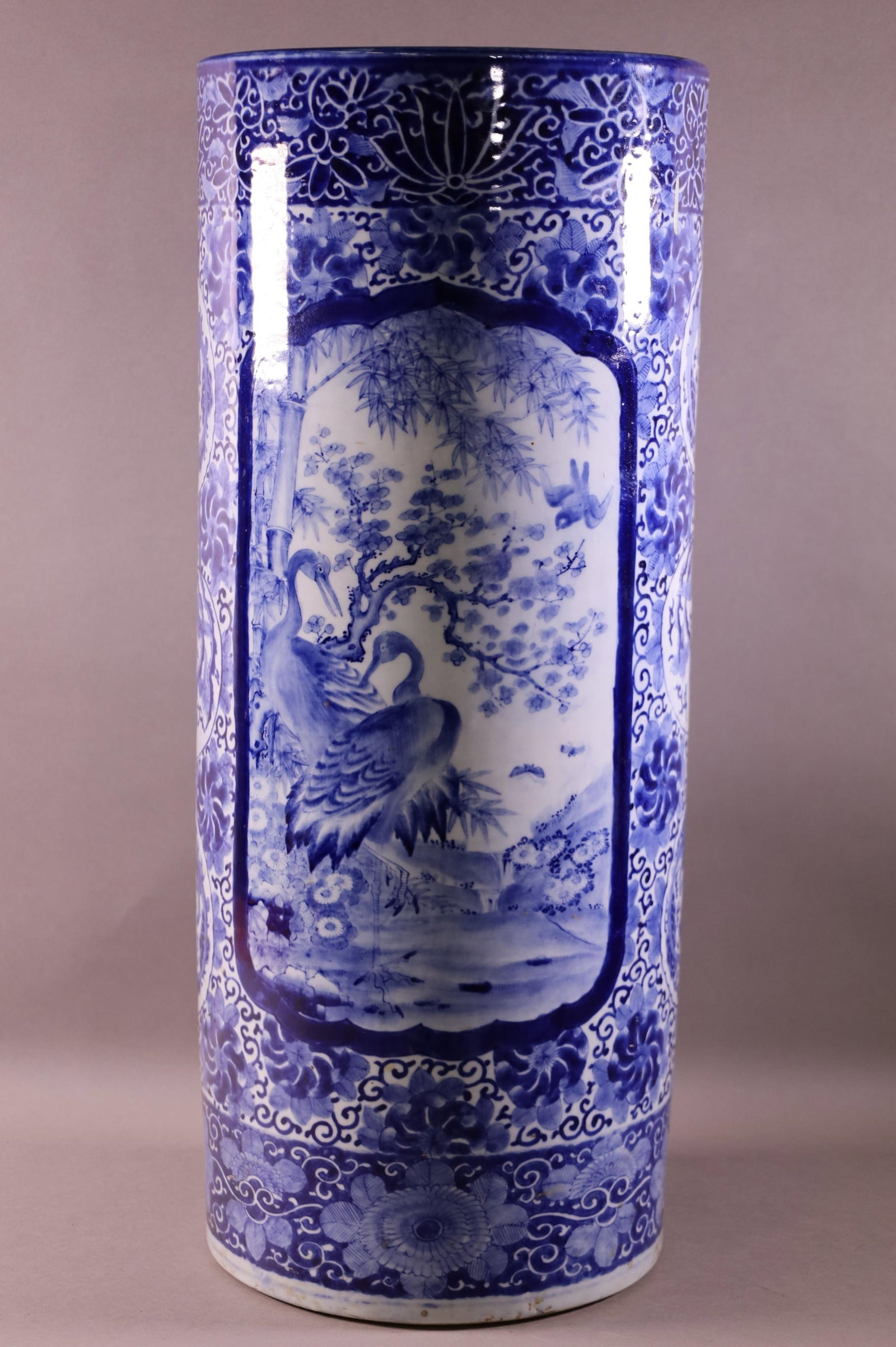 CHINESE BLUE & WHITE PORCELAIN UMBRELLA STAND: SIGNED ON BOTTOM. 24 1/2" TALL X 9 3/4" DIAMETER.