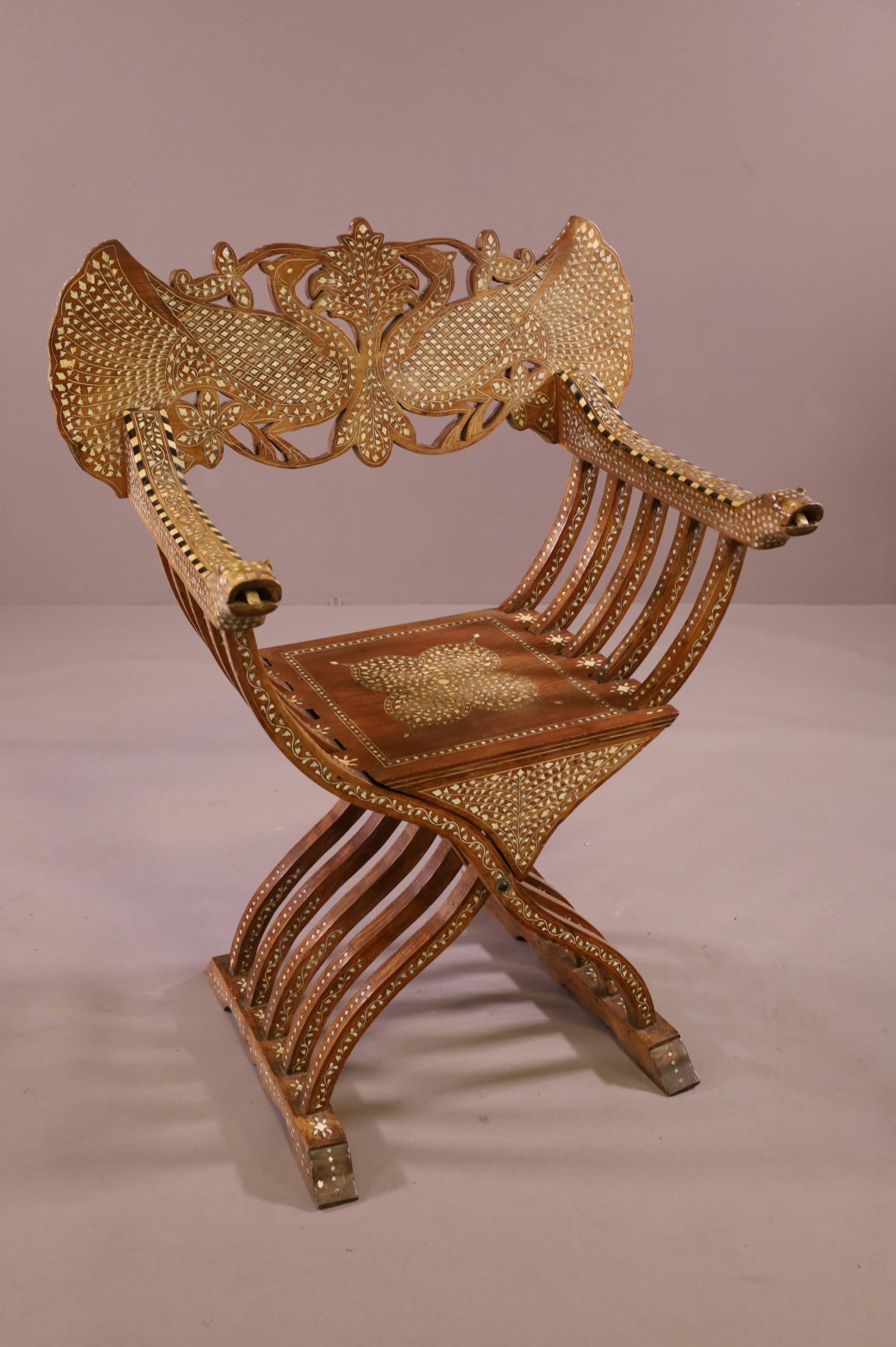 MOROCCAN INLAID SIDE CHAIR: PEACOCK DECORATED CHAIR BACK, HIGHLY INLAID MOROCCAN STYLE ARMCHAIR. SOME MISSING INLAY. 29" W x 19" D x 38" H. THIS ITEM EXCEEDS SIZE LIMITATIONS FOR IN HOUSE SHIPPING.