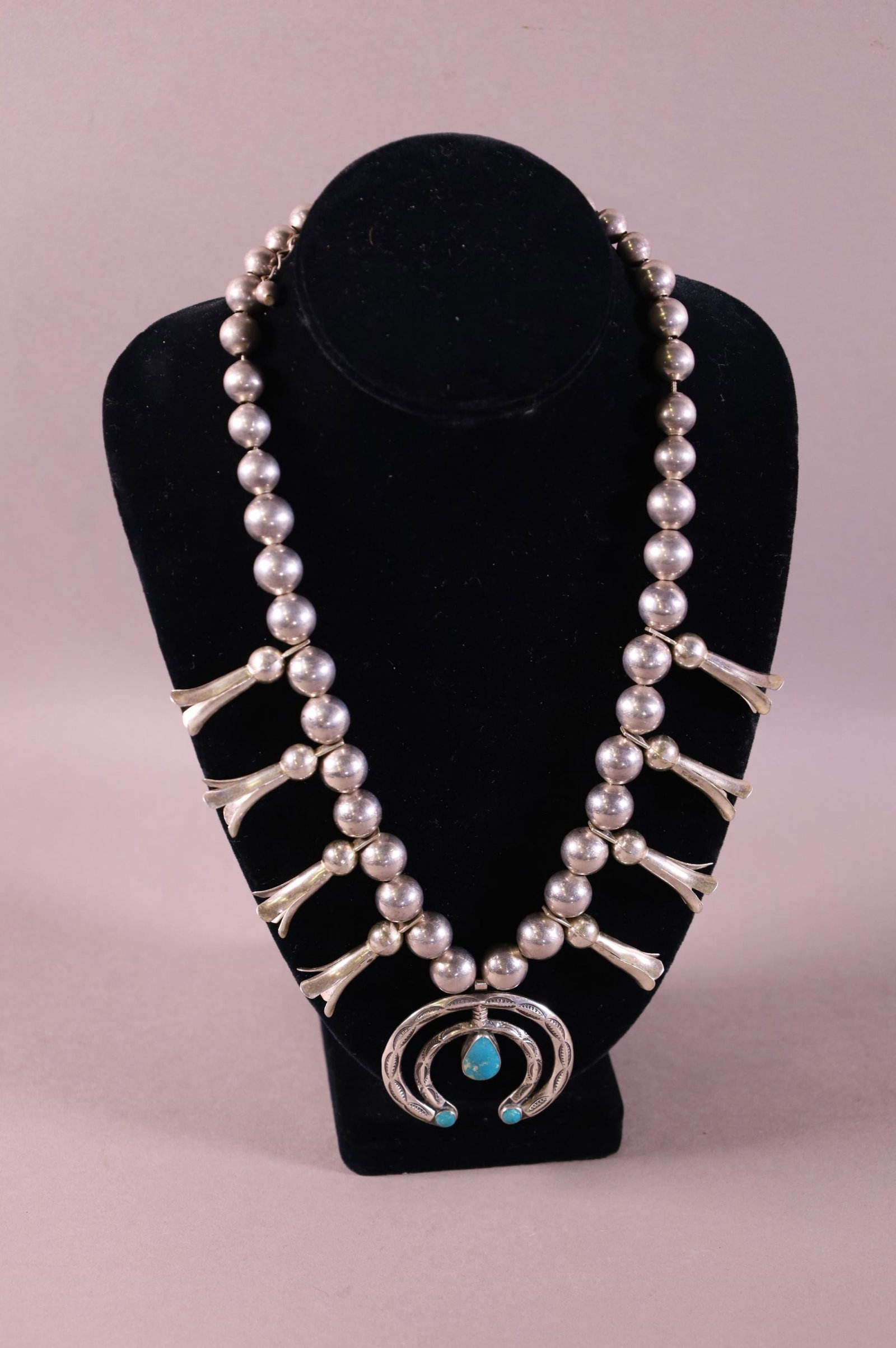 NATIVE AMERICAN SQUASH BLOSSOM: LARGE NATIVE AMERICAN SILVER AND TURQUOISE SQUASH BLOSSOM. 21" L