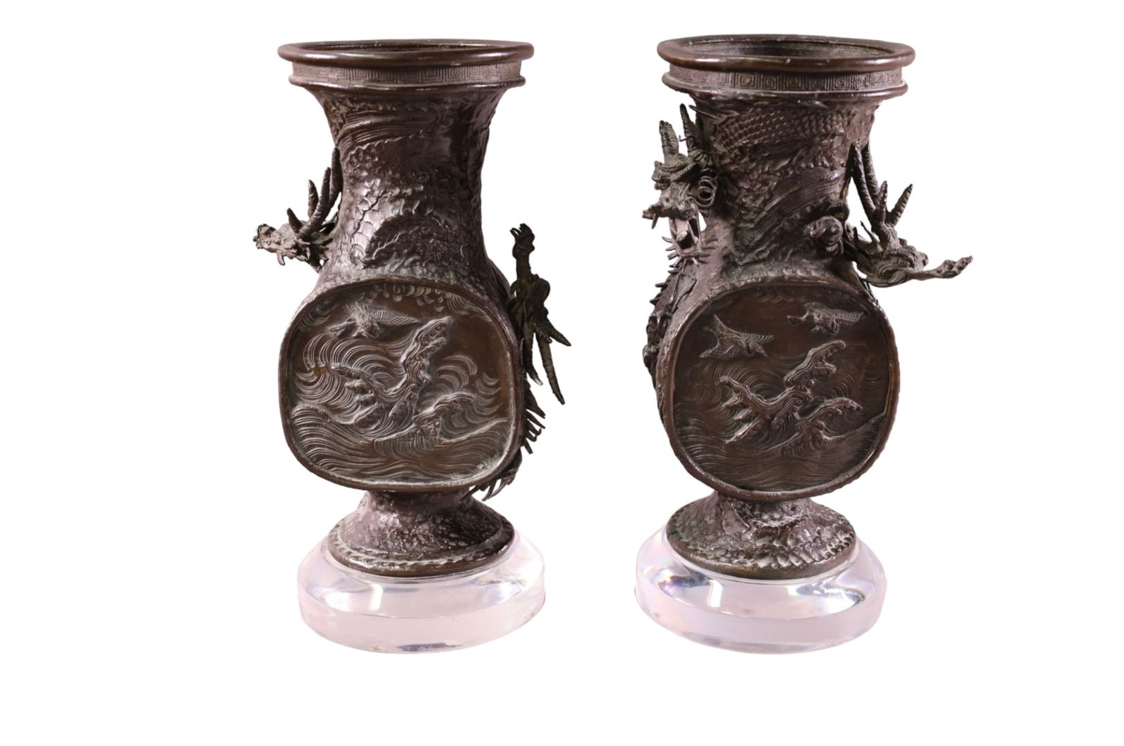 PAIR OF JAPANESE BRONZE URNS: PAIR OF BRONZE URNS, ON LUCITE BASE, DRAGON MOTIF. 13" H.