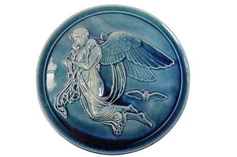 CLEMENT MASSIER PLAQUE: GREEN GLAZED PLAQUE, ANGEL WITH CHILDREN. MARKED ON REVERSE. GOLFE JUAN. SMALL CHIP TO TOP. 9 1/2" DIAM.