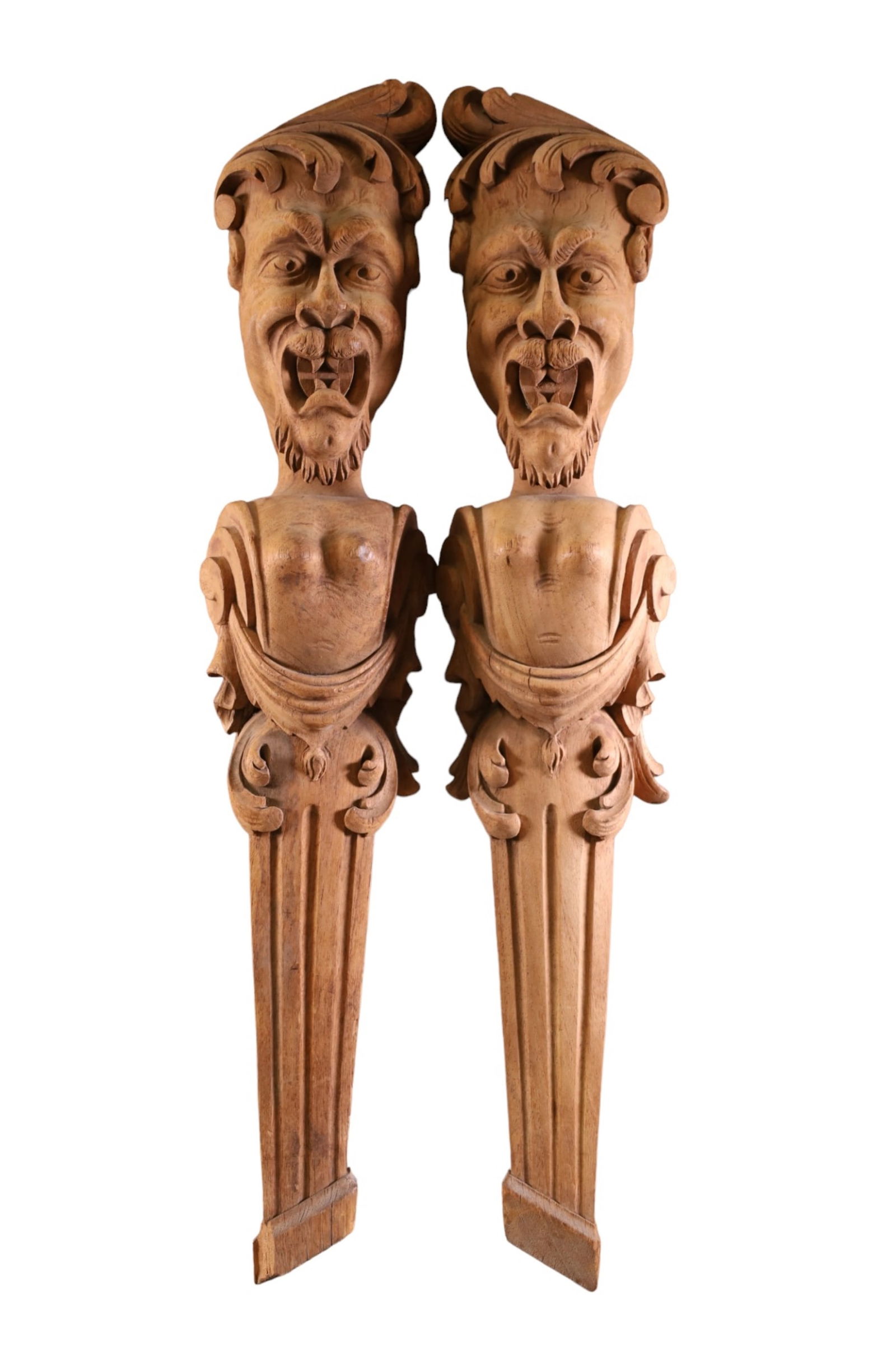 PAIR OF WOODEN FIGUREL CORBELS: HAND CARVED WOODEN FIGURAL CORBELS. CHIP TO ONE. 28" H.