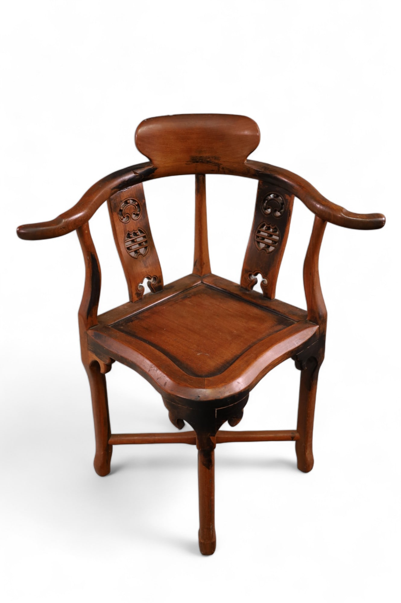 CHINESE CORNER CHAIR: CARVED CHINESE HARDWOOD CORNER CHAIR, WEAR TO FINISH, BREAK IN JOINT OF ARM. 29" W x 21" D x 34" H. THIS ITEM EXCEEDS SIZE LIMITATIONS FOR IN HOUSE SHIPPING.