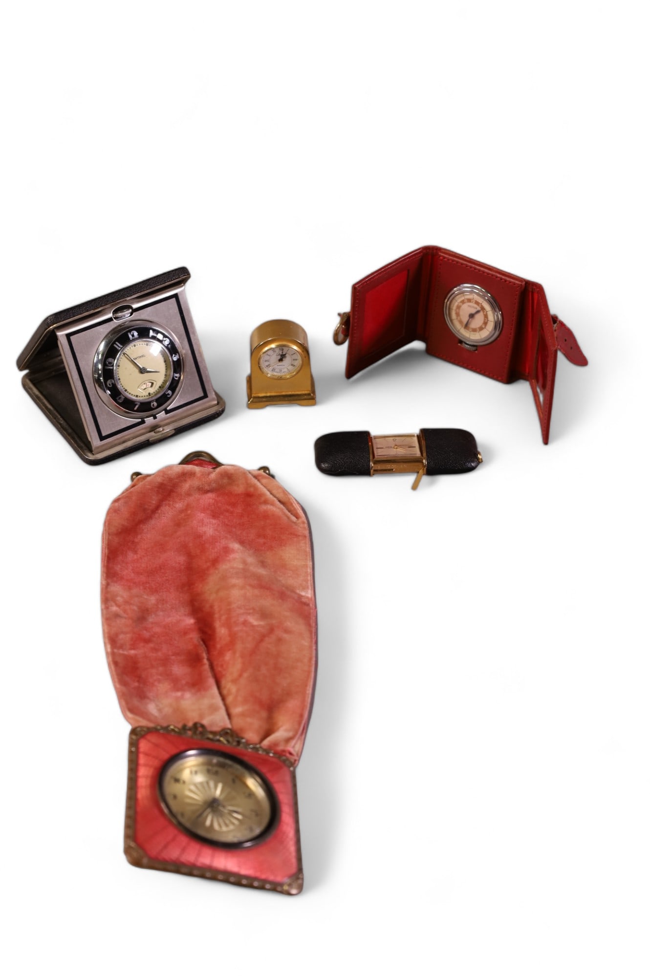 5 TRAVEL CLOCKS: SENTINEL MADE BY INGRAHAM. KELTON IN LEATHER CASE. ORIS. 1 HAS ENAMELING. ALL CLOCKS ARE SOLD AS IS WE DO NOT GUARANTEE WORKING ORDER.