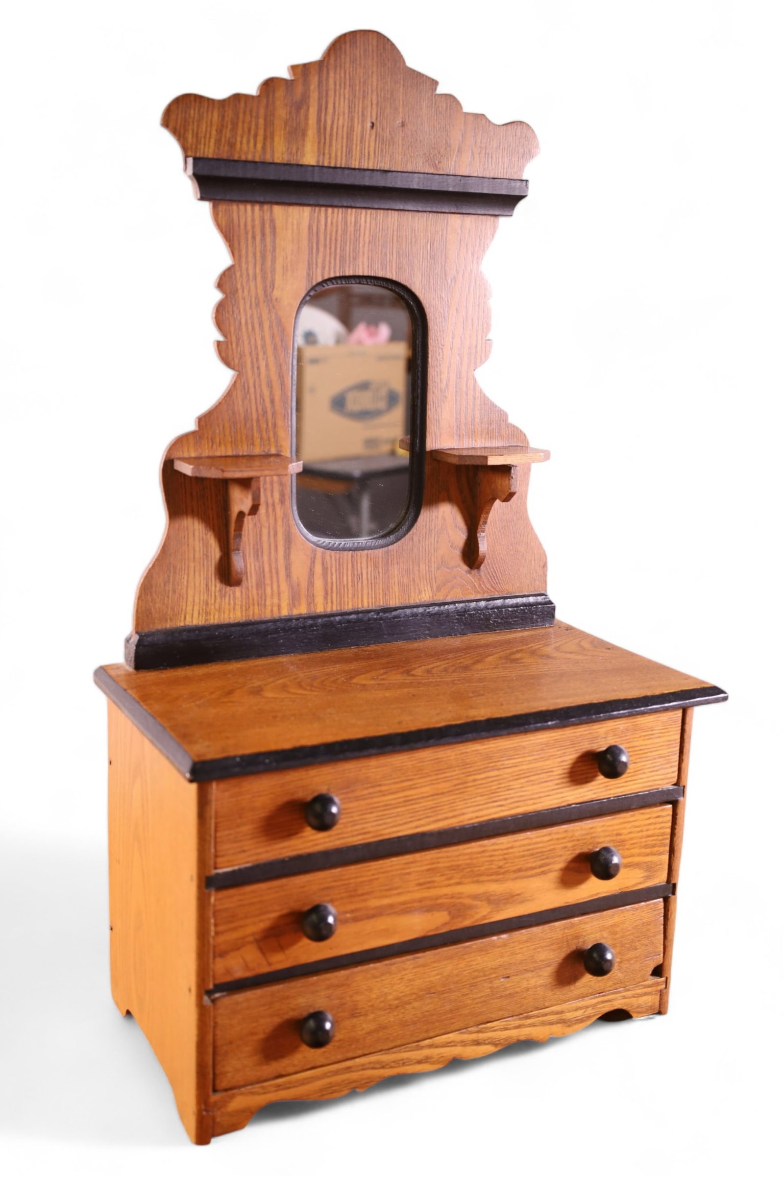 CHILD'S OR DOLL EASTLAKE DRESSER: EASTLAKE VICTORIAN CHILD'S DRESSER WITH MIRROR. CHIP TO ONE DRAWER. 13 1/2" W x 7" D x 24" H.