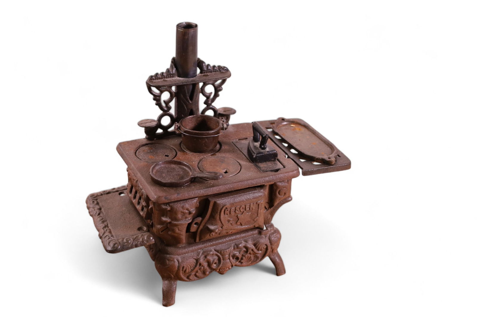 CAST IRON TOY STOVE: CRESCENT STOVE WITH PARTS, PANS AND IRON. 9" H