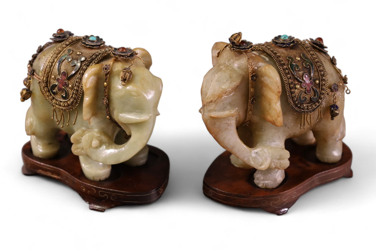 PAIR OF CHINESE STONE ELEPHANTS: CARVED STONE ELEPHANTS, ON WOODEN STANDS. WITH WIRE ENAMEL DECORATION INCLUDING TURQUOISE AND CORAL. 4" W x 4" H.