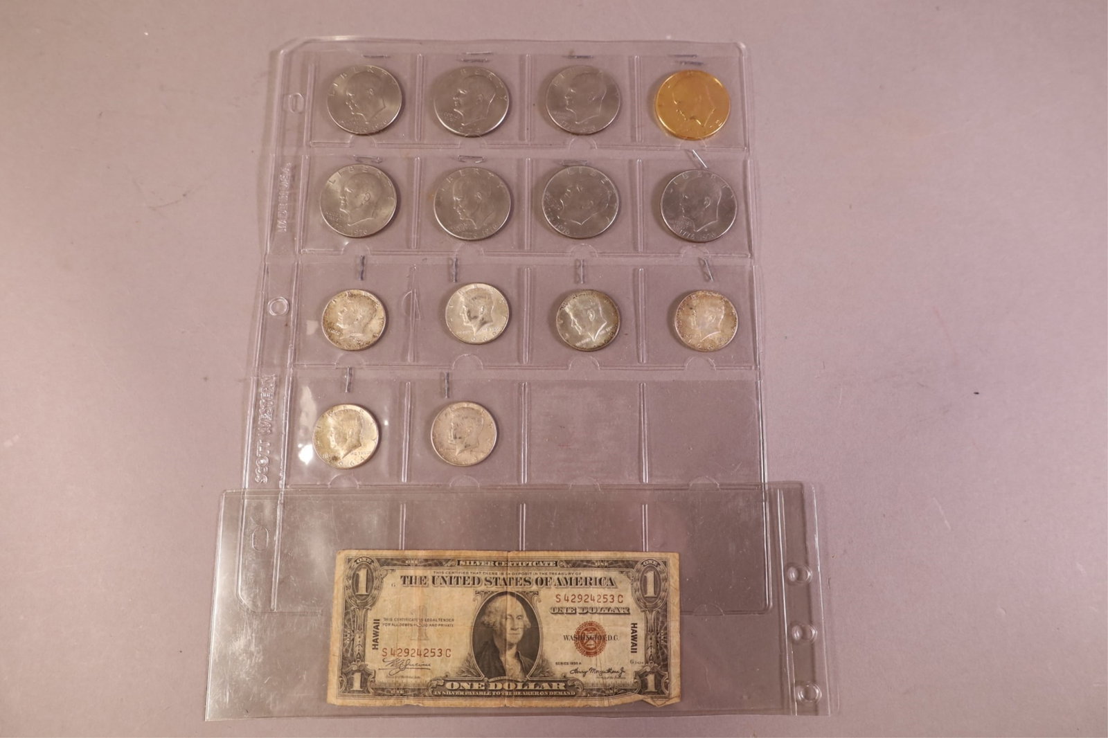 LOT OF UNITED STATES CURRENCY: 8 DOLLARS, 6 KENNEDY HALVES, & 1935 HAWAII DOLLAR.