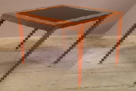 Dakota Jackson Tango Game Table: The Tango Table, like its namesake, requires precise execution. The carved, hardwood legs possess a particular animated quality. There is much for the eye to take in: the sculptural attenuated legs, t