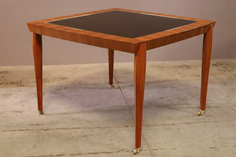 Dakota Jackson Tango Game Table: The Tango Table, like its namesake, requires precise execution. The carved, hardwood legs possess a particular animated quality. There is much for the eye to take in: the sculptural attenuated legs, t