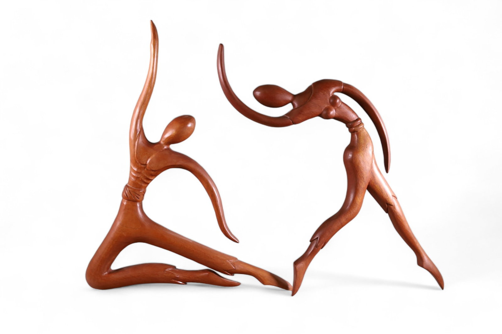 PAIR OF JOSE PINAL WOODEN SCULPTURES: PAIR OF JOSE PINAL WOODEN SCULPTURES PAIR OF CARVED WOODEN DANCERS, SIGNED ON REVERSE, SIGNED J. PINAL. 25" H.