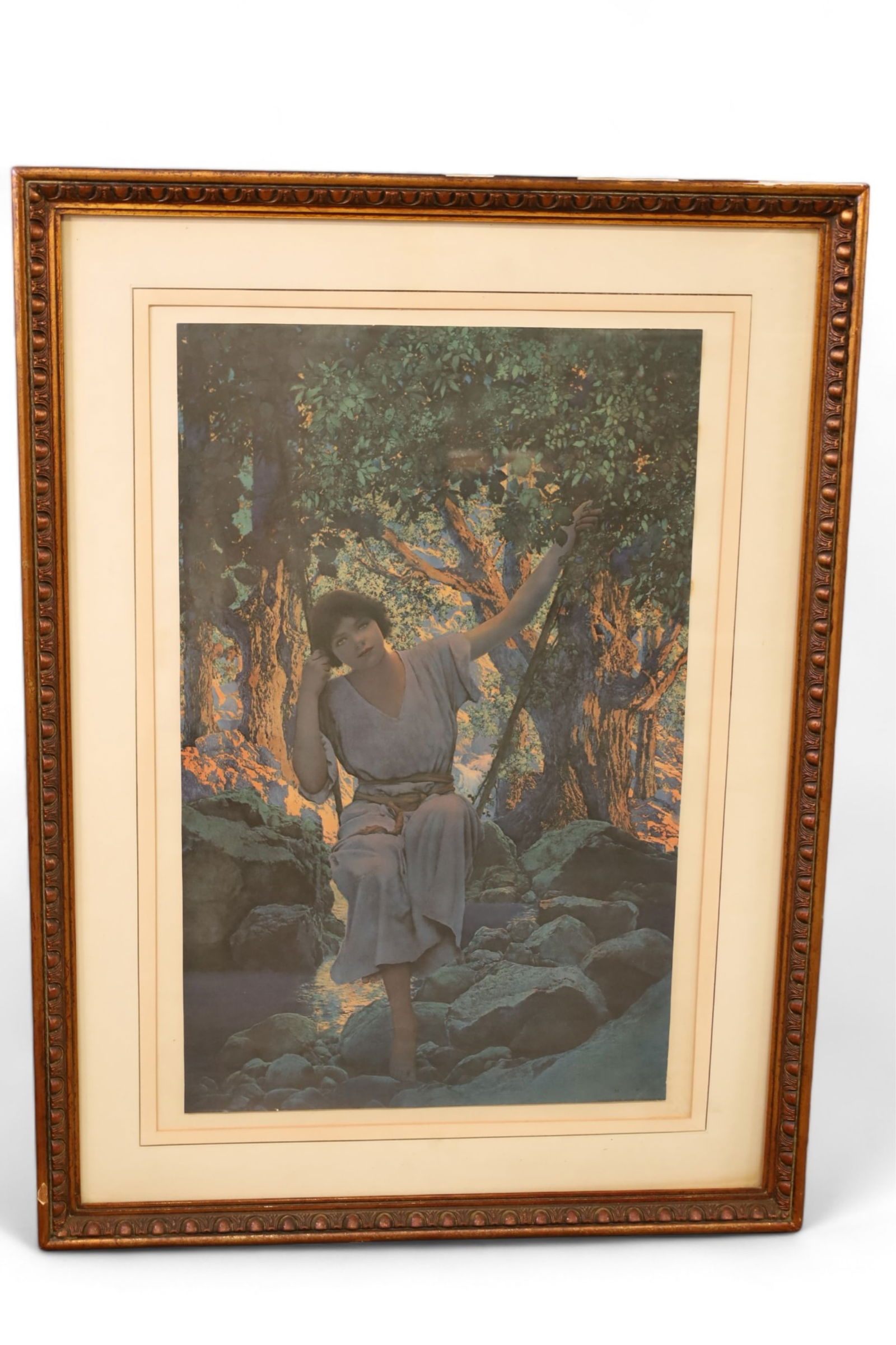 MAXFIELD PARRISH FRAMED PRINT: TITLED DREAMLIGHT - HIDEOUT, FRAMED PRINT BY MAXFIELD PARRISH, SOME DAMAGE TO FRAME. 28" x 39" ITEM EXCEEDS SIZE LIMITATIONS FOR IN HOUSE SHIPPING, IT MUST BE PICKED UP IN HOUSE OR SHIPPED VIA 3RD PAR