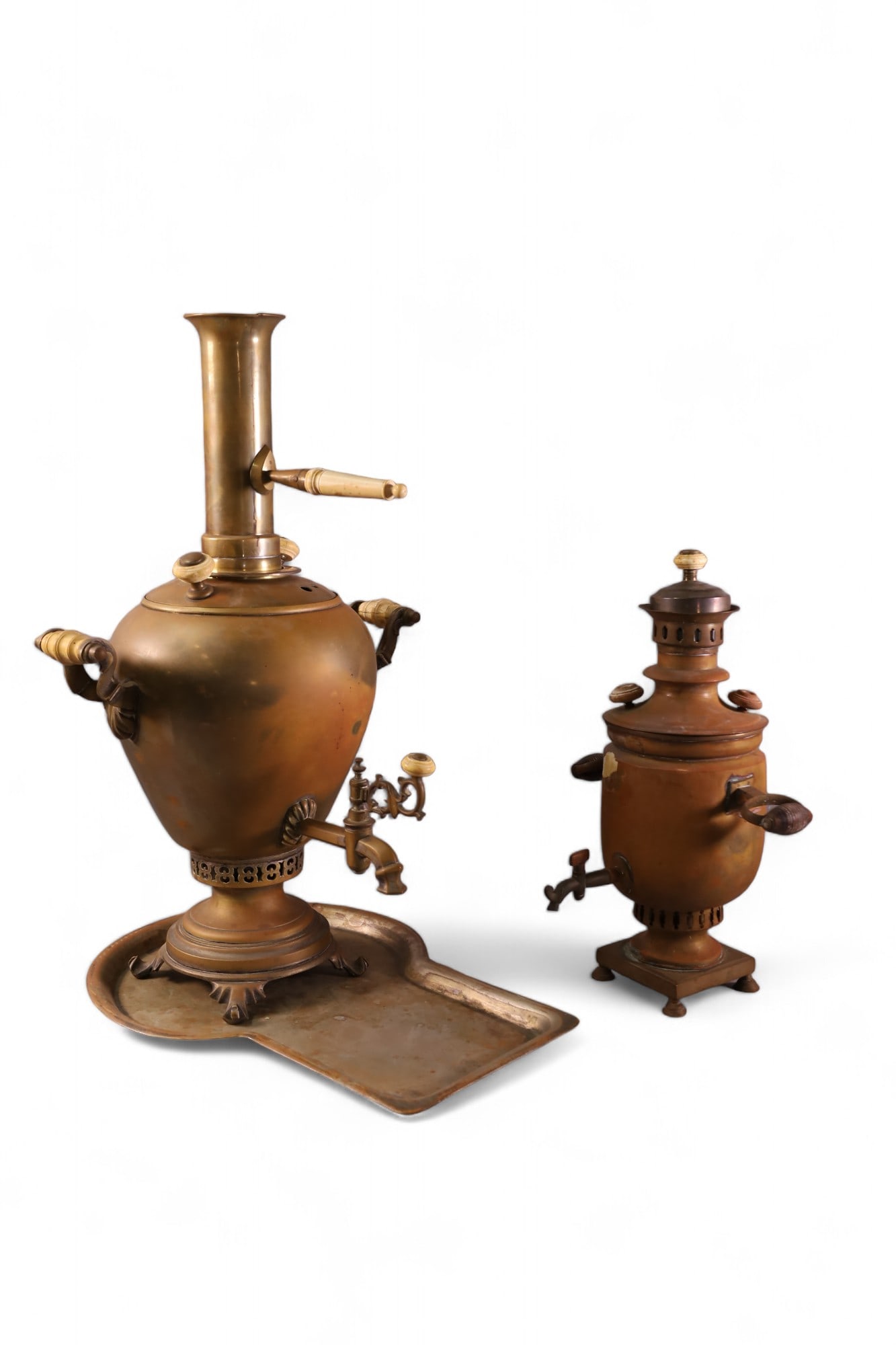 2 METAL SAMOVARS: ANTIQUE METAL SAMOVARS, WEAR. 15" - 23" H.