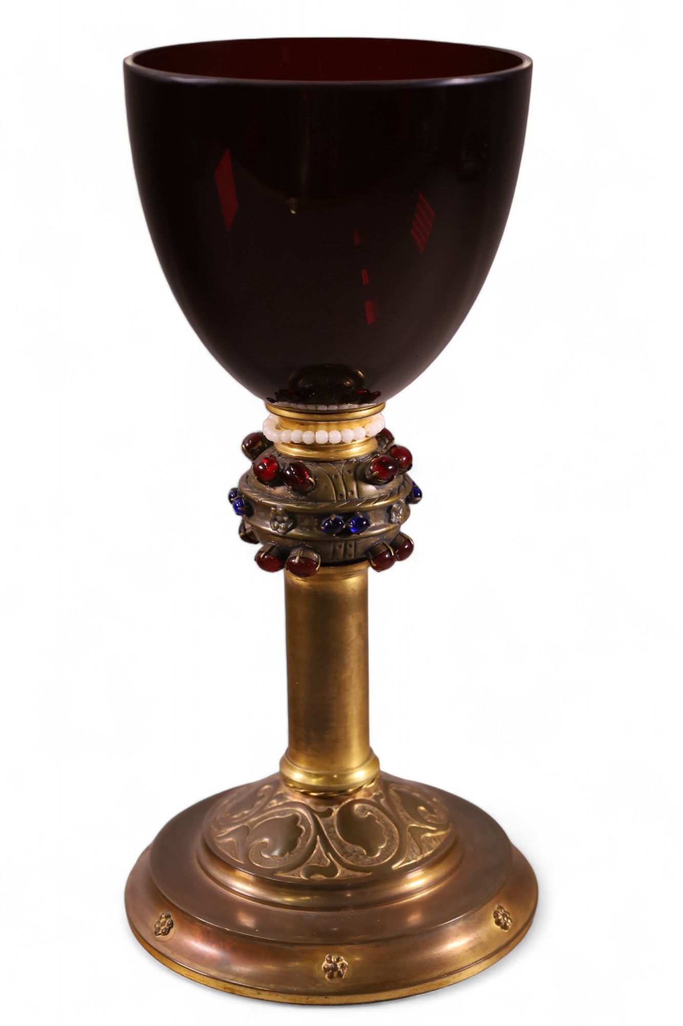 JEWELED CHALICE: DECORATED GILT METAL AND WITH RED AND BLUE STONES. 10" H.