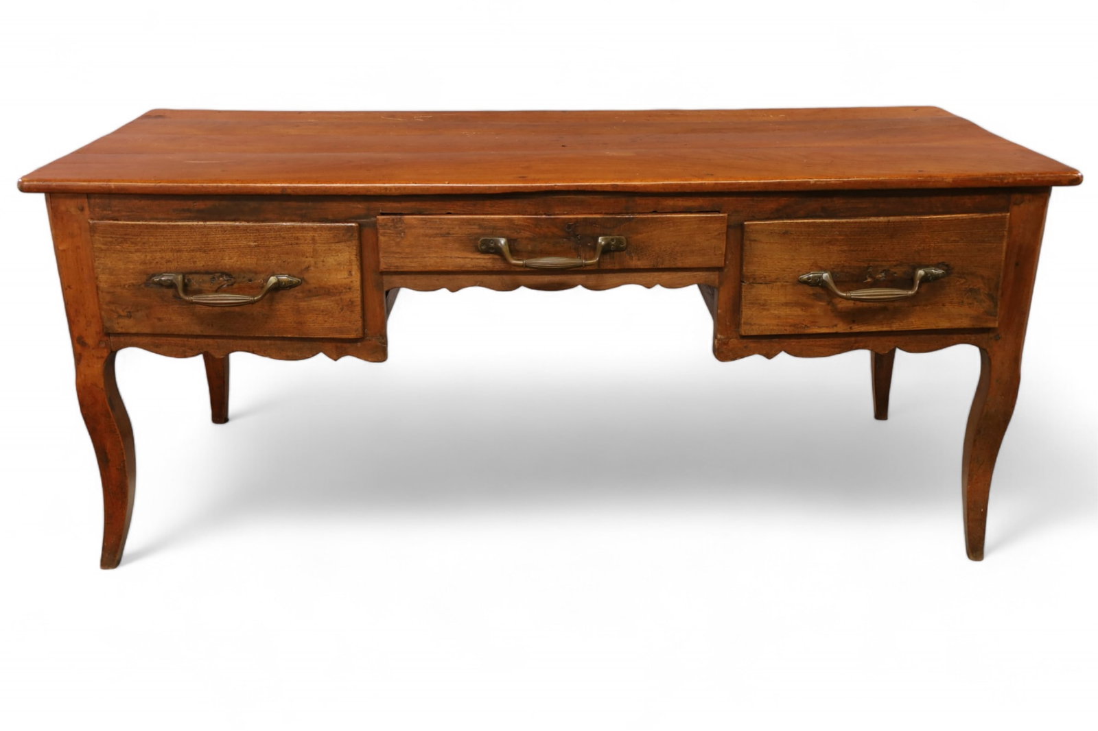 ANTIQUE COUNTRY FRENCH DESK: LARGE THREE DRAWER COUNTRY FRENCH DESK, REPLACED HARDWARE. PEGGED CONSTRUCTION. 70" L x 28" W x 30" H. THIS ITEM EXCEEDS SIZE LIMITATIONS FOR IN HOUSE SHIPPING, MUST BE SHIPPED VIA 3rd PARTY GROUND SH