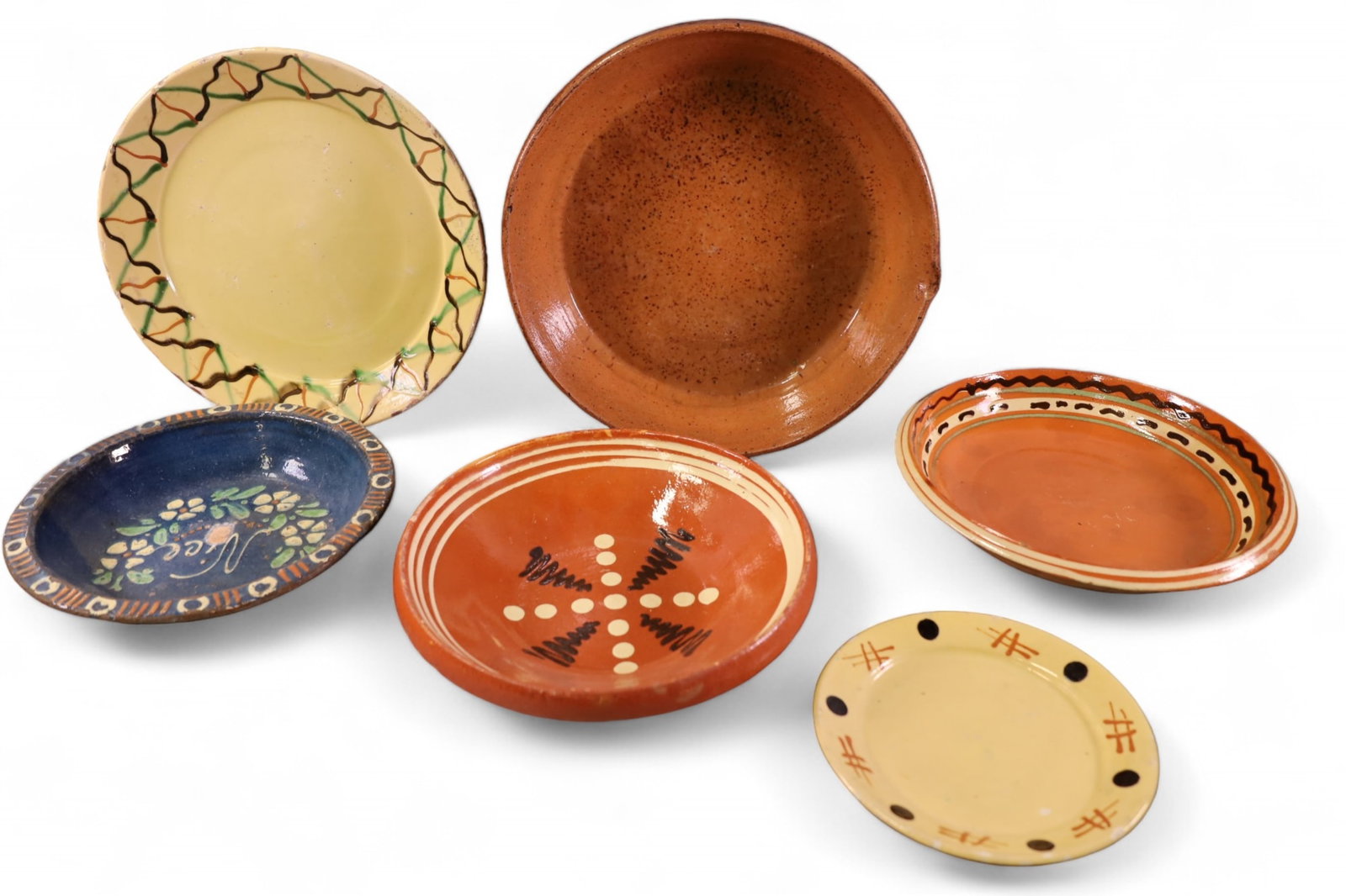 6 PIECES OF FRENCH POTTERY: ANTIQUE FRENCH POTTERY TRAYS. SOME CHIPS. 7 1/2" - 13" DIAM.