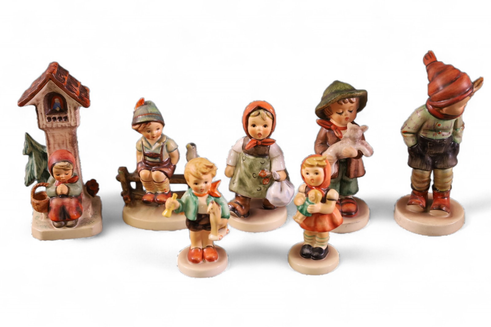 7 HUMMEL FIGURES: INCLUDING WORSHIP, THE LOST SHEEP, GRANDMA'S GIRL. AND MORE. 3 1/2" - 5" H