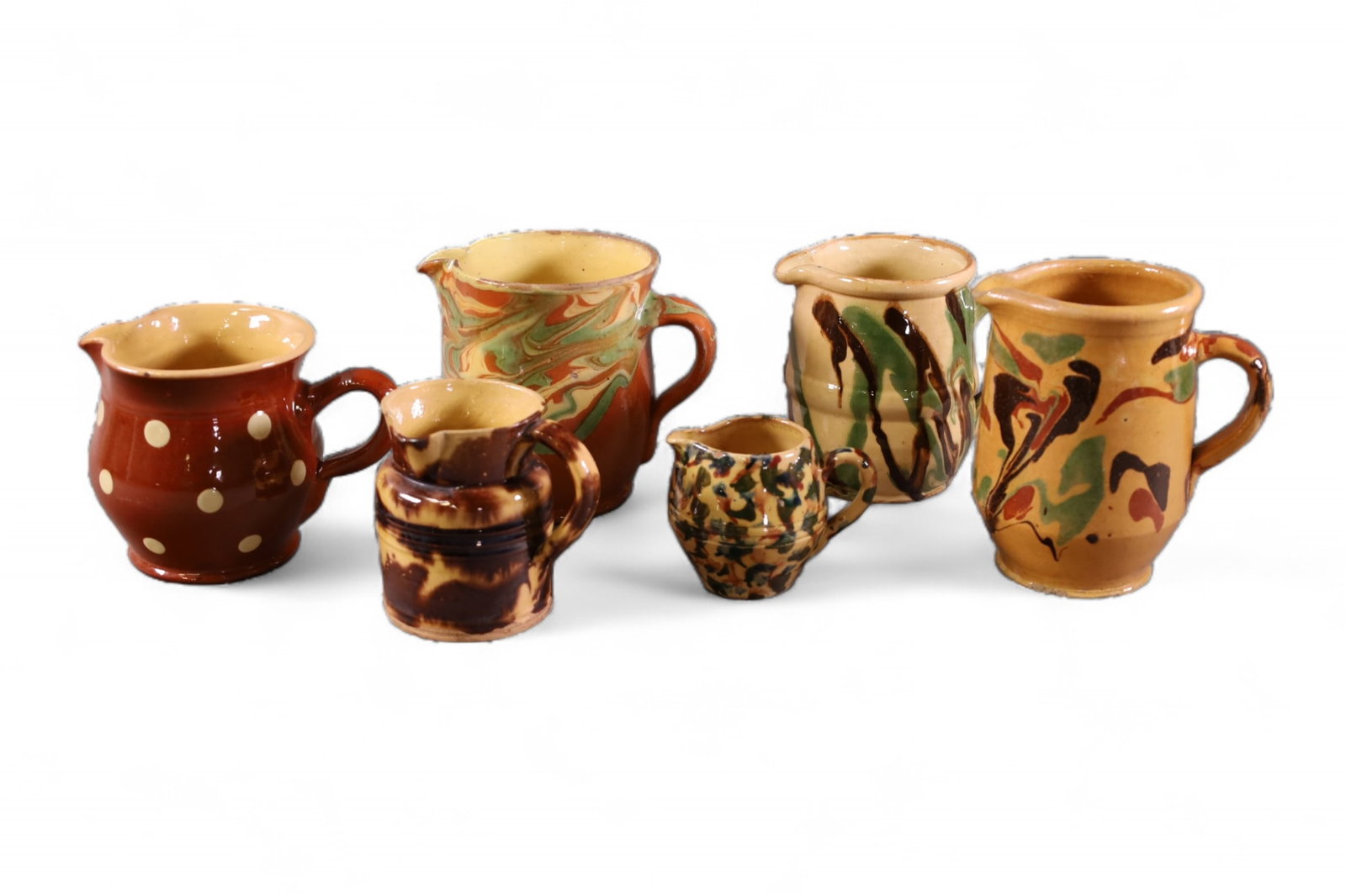 6 PIECES OF FRENCH POTTERY: 6 PIECES OF ANTIQUE FRENCH POTTERY PITCHERS. SOME CHIPS. 3" - 6" H.