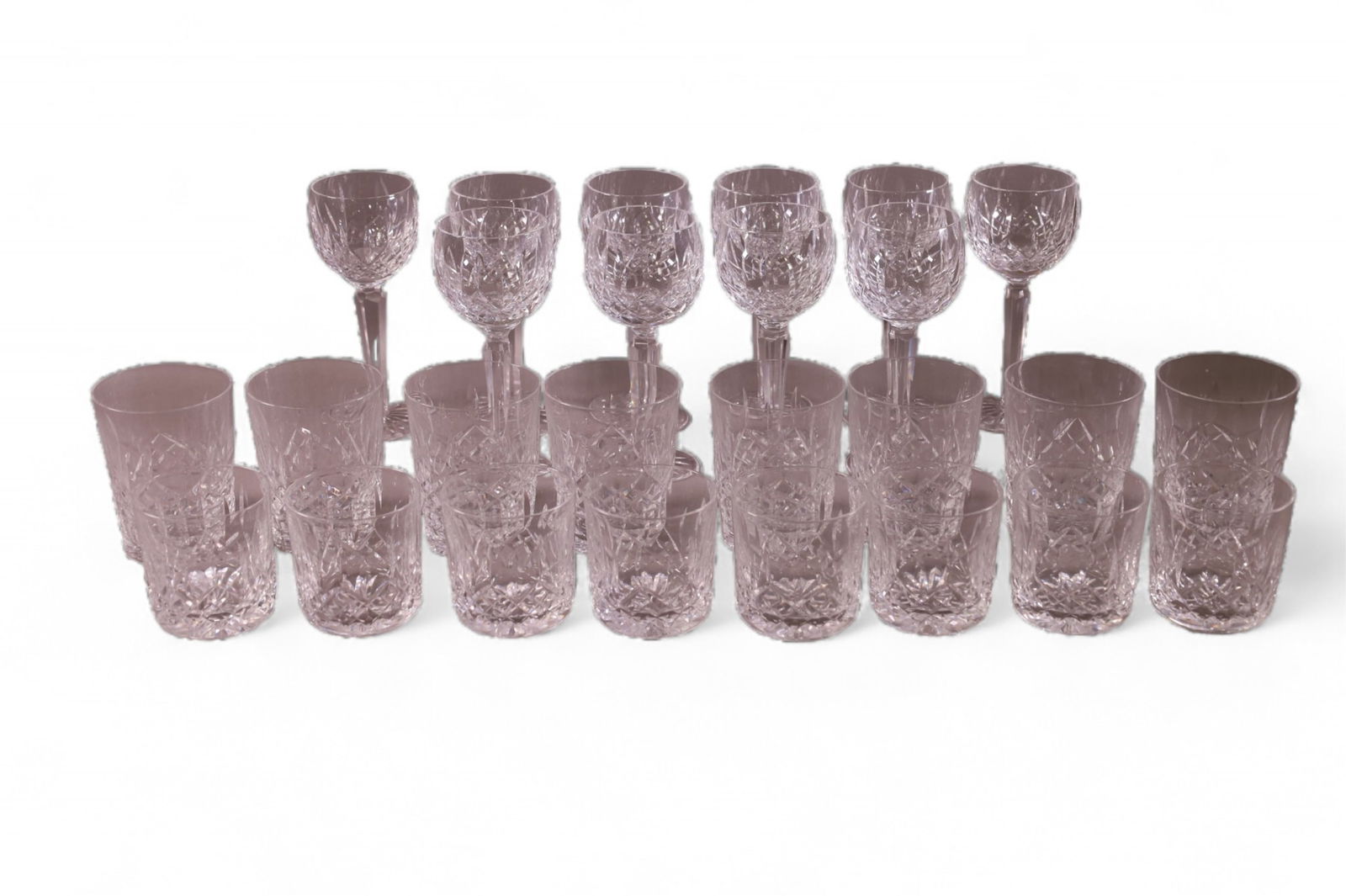 26 PIECES OF WATERFORD CRYSTAL: TEN 7 1/2" WINE GLASSES, EIGHT 4 1/2" TUMBLERS, EIGHT 3 1/2" ROCKS GLASSES. MARKED WATERFORD.