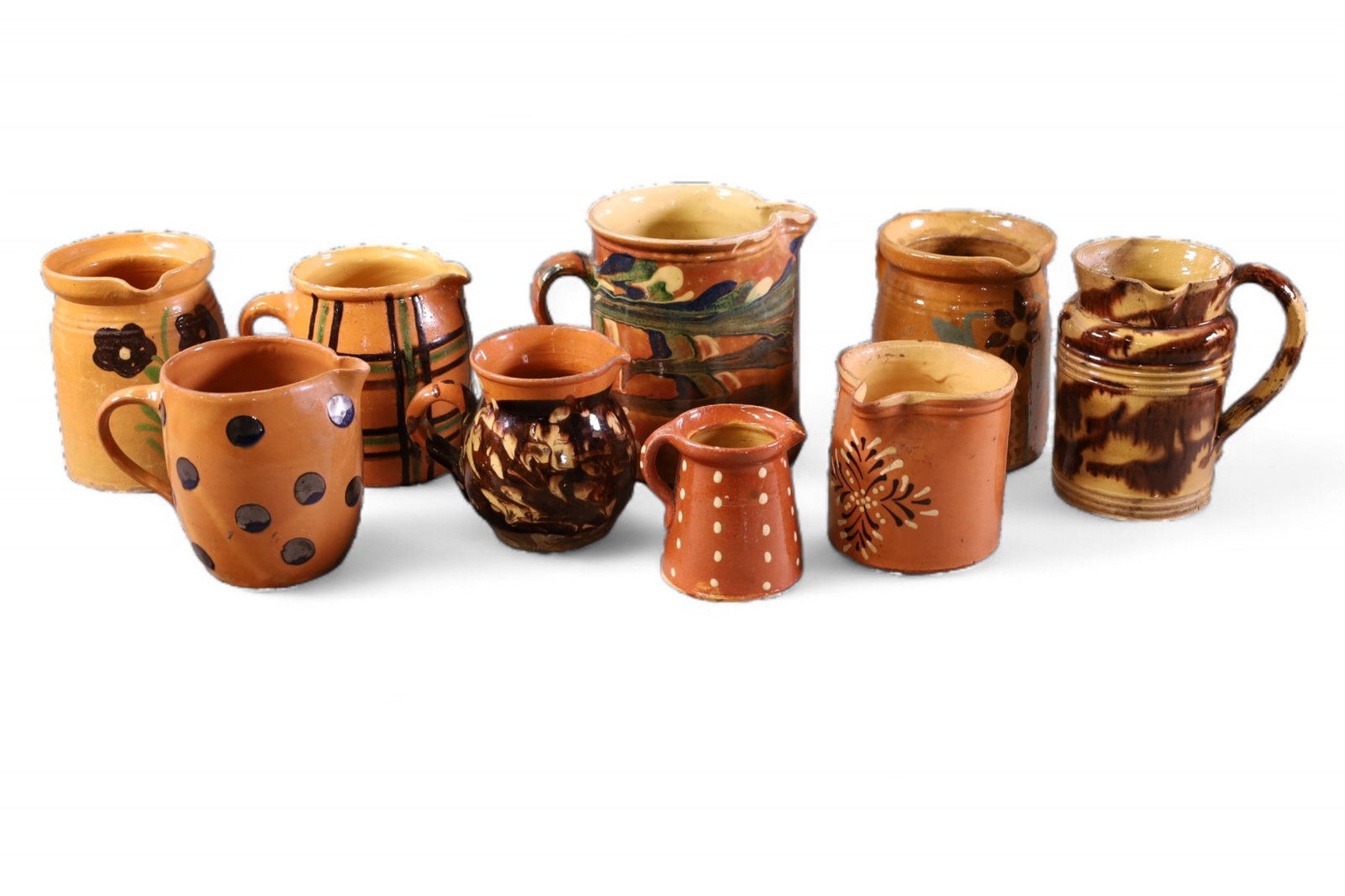 9 PIECES OF FRENCH POTTERY: 9 PIECES OF ANTIQUE FRENCH POTTEYR PITCHERS, SOME CHIPS. 4 - 7" H.