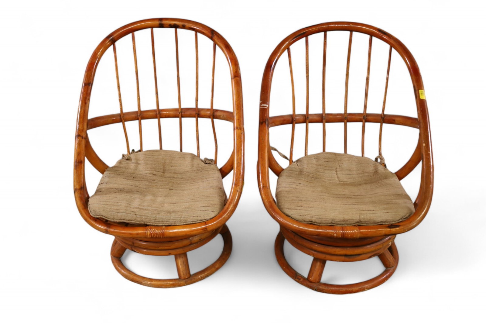 PAIR OF RATTAN CHILD'S CHAIRS: PAIR OF SWIVEL RATTAN CHILD'S LOUNGE CHAIRS, 20" W x 20" D x 29" H. THIS ITEM EXCEEDS SIZE LIMITATIONS FOR IN HOUSE SHIPPING, IT MUST BE SHIPPED VIA 3rd PARTY GROUND SHIPPER OR PICKED UP IN HOUSE.