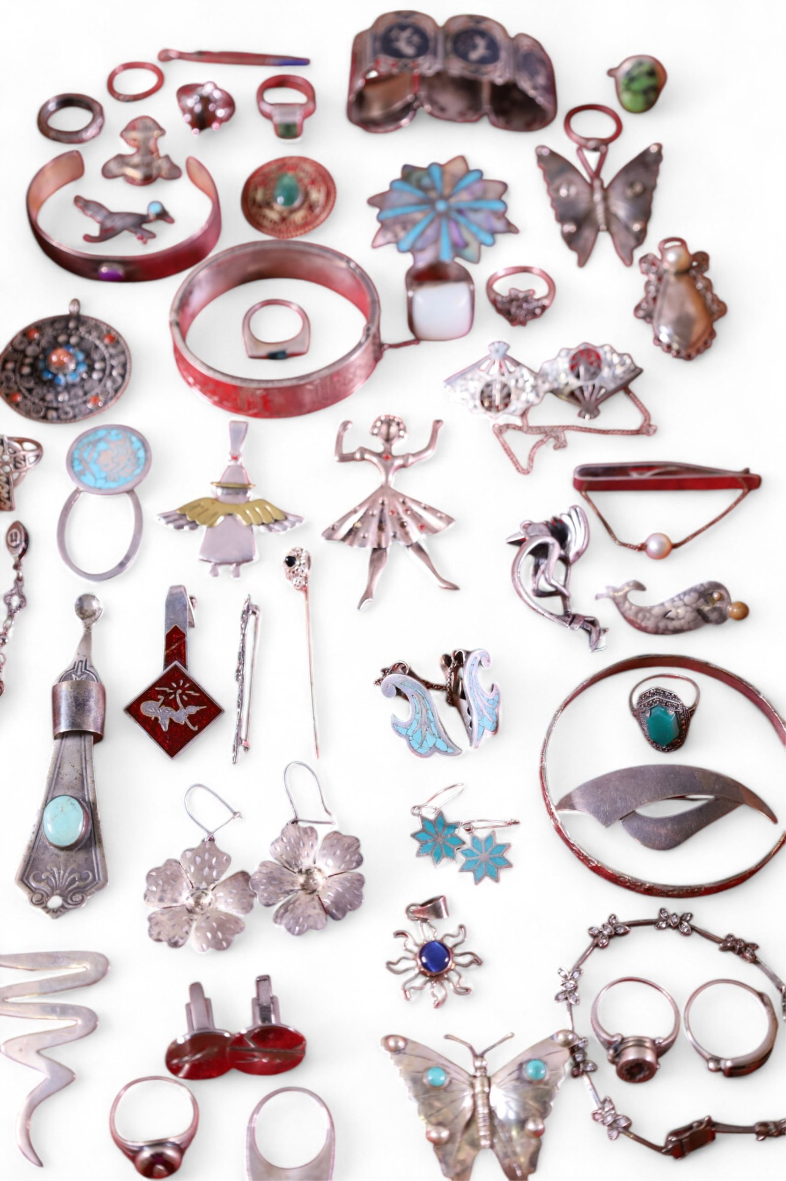 COLLECTION OF SILVER JEWELRY: INCLUDING BRACELETS, RINGS, PINS, AND MORE. SHOWCASE NOT INCLUDED.