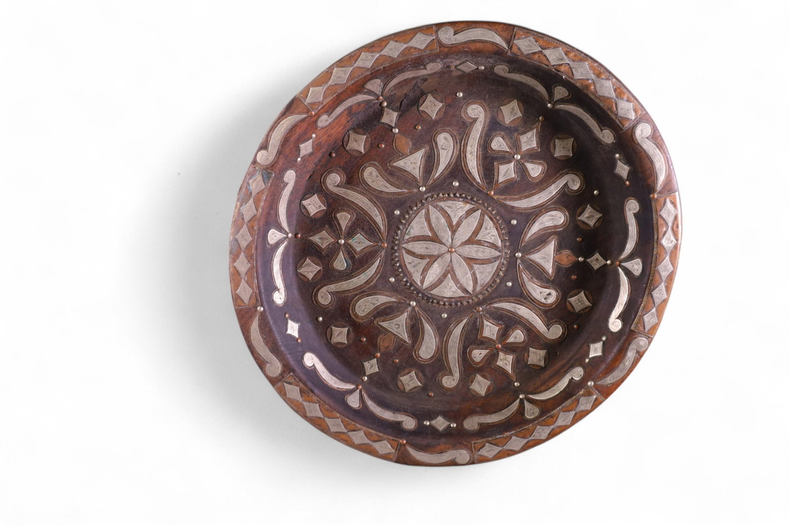 PERSIAN CENTER BOWL: WOODEN CENTER BOWL WITH SILVER AND BRASS APPLIED DECORATION. 21" DIAM.