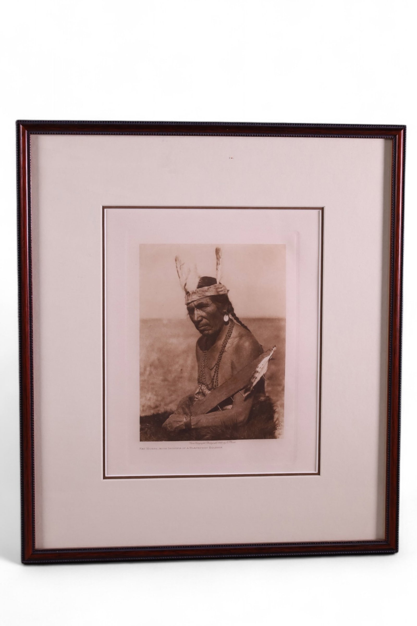 EDWARD CURTIS PHOTOGRAVURE: FAT HORSE WITH INSIGNIA OF BLACK FOOT SOLDIER. DATED 1926. 8" x 10" IMAGE SIZE / 14 1/2" X 16" IN FRAME.