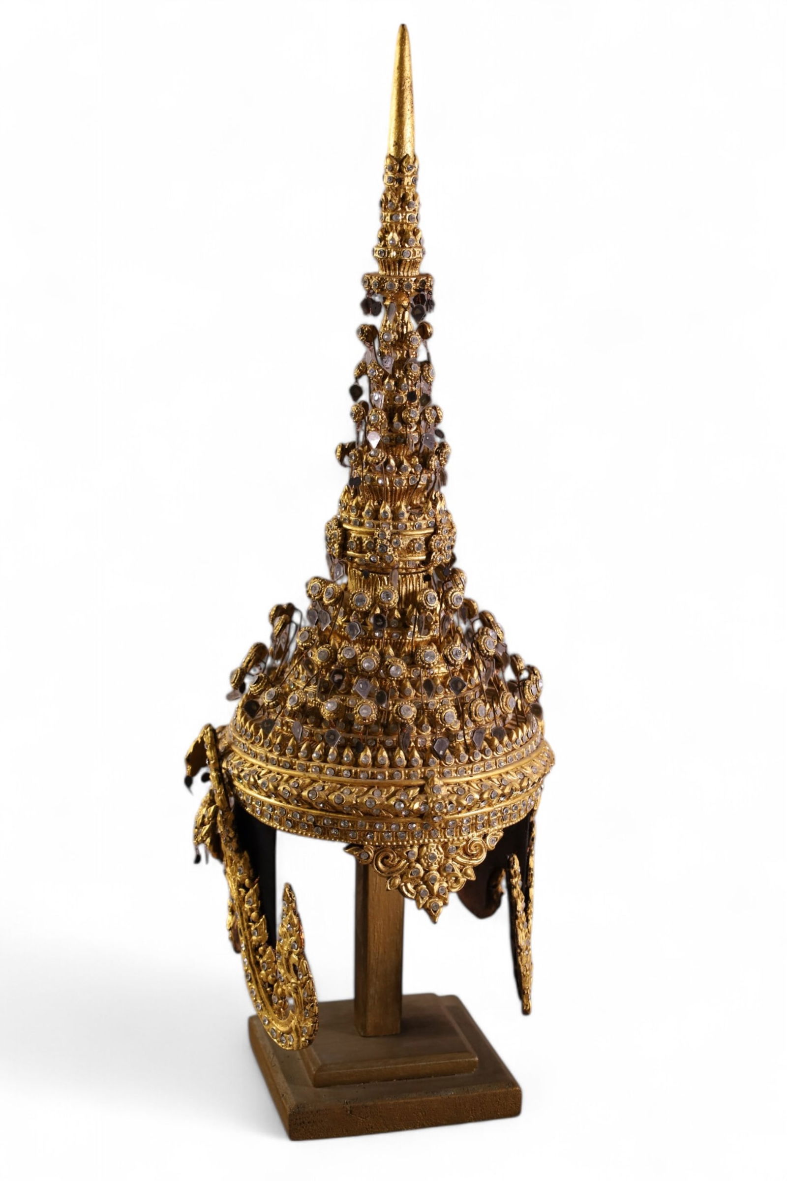 THAI CEREMONIAL HELMET: HIGHLY DECORATED THAI CEREMONIAL HELMET. ON STAND. 24" H.