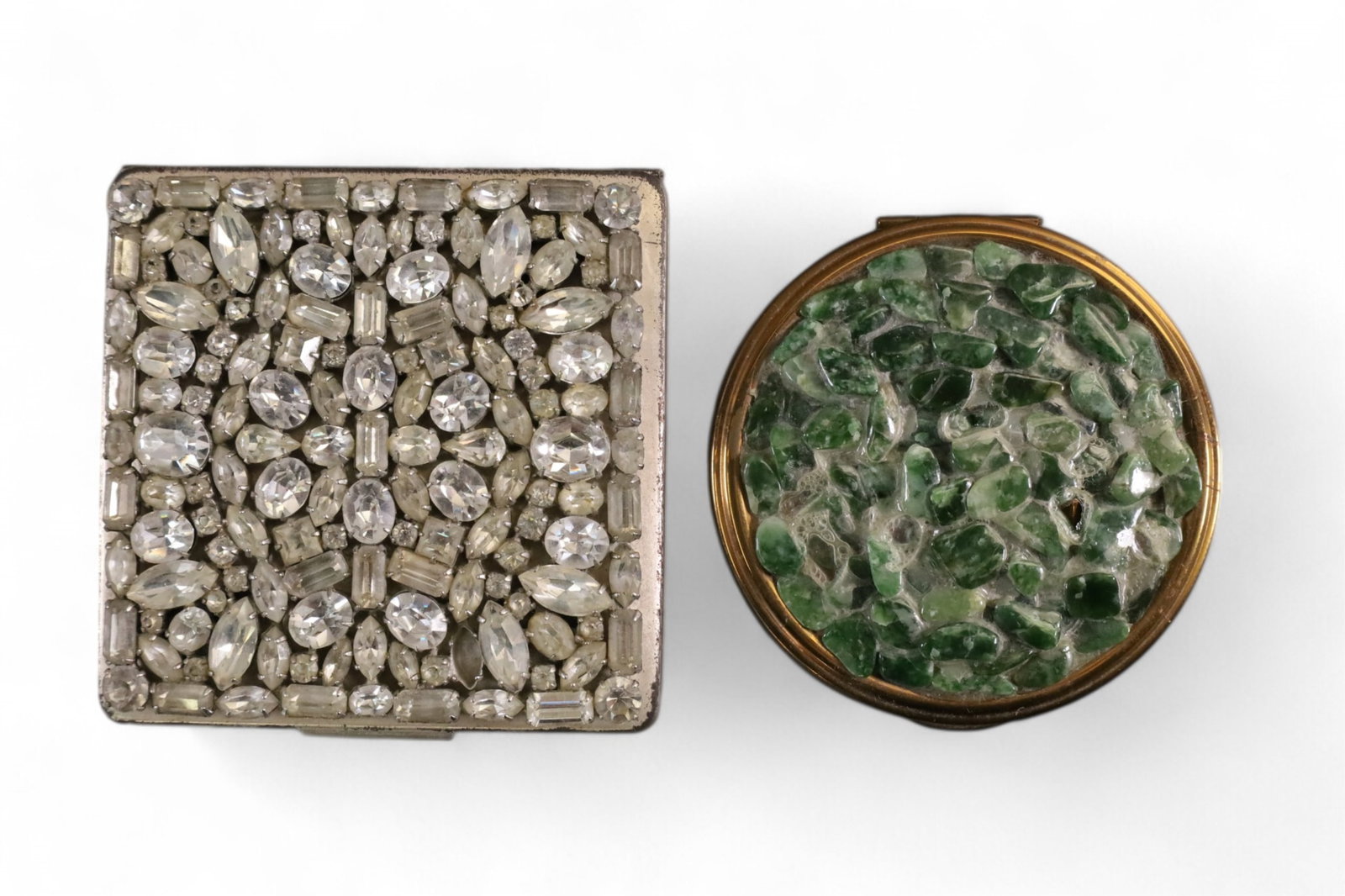 2 COMPACTS: 2 JEWELED COMPACTS, HINGED COMPACTS. MISSING SOME STONES. 3 1/2" & 3" DIAM.