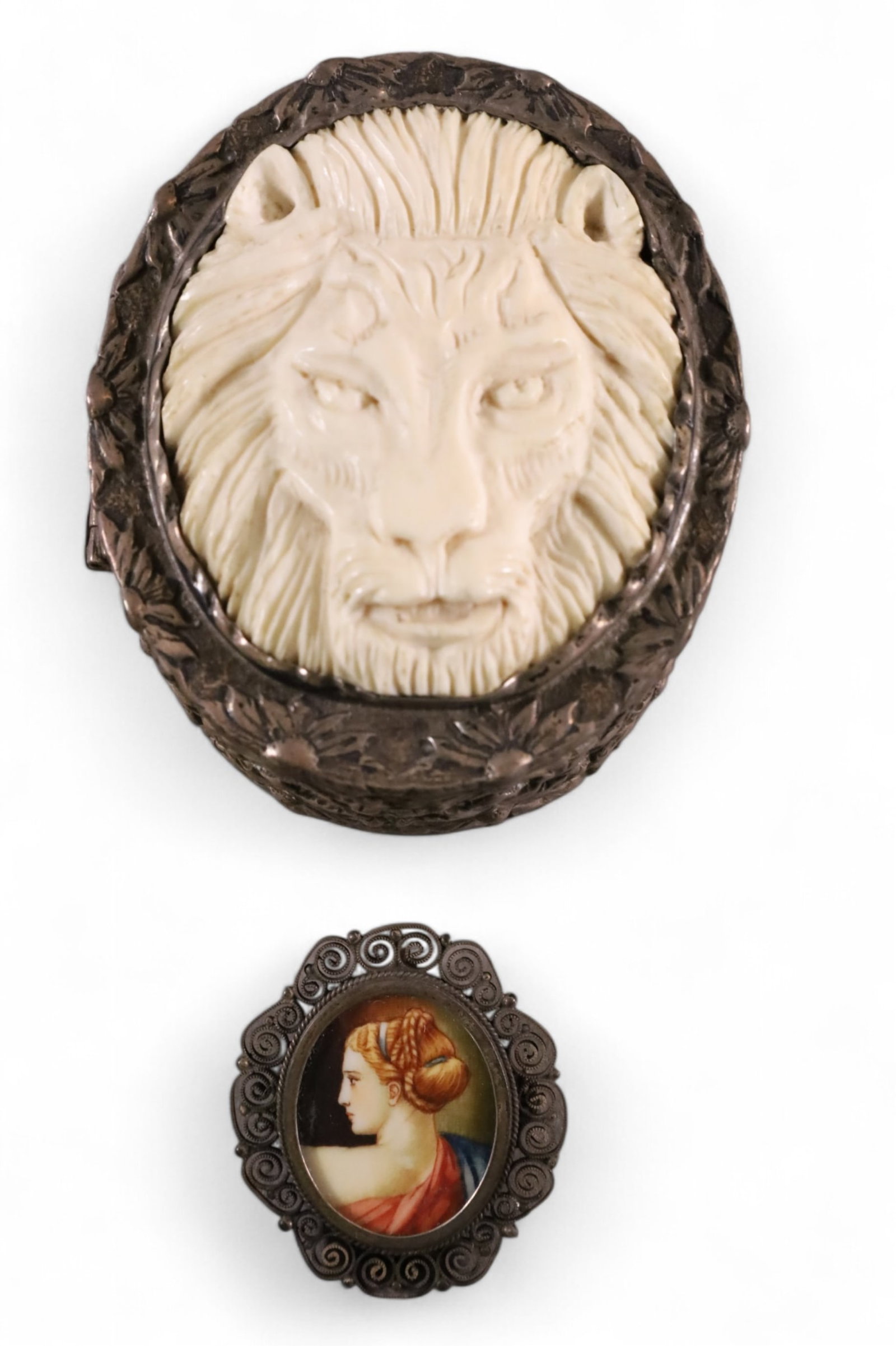 2 DRESSER ITEMS: HINGED DRESSER BOX, REPOUSSE SILVER WITH BONE CARVED LION DECORATED TOP. 2" x 2" & PIN. 1" W