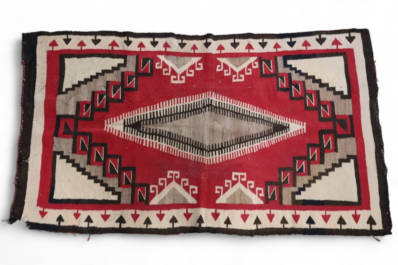 NAVAJO RUG: HANDMADE NATIVE AMERICAN NAVAJO RUG. EDGE WEAR, STAINS, BLEEDING. APPROX 63" x 34"
