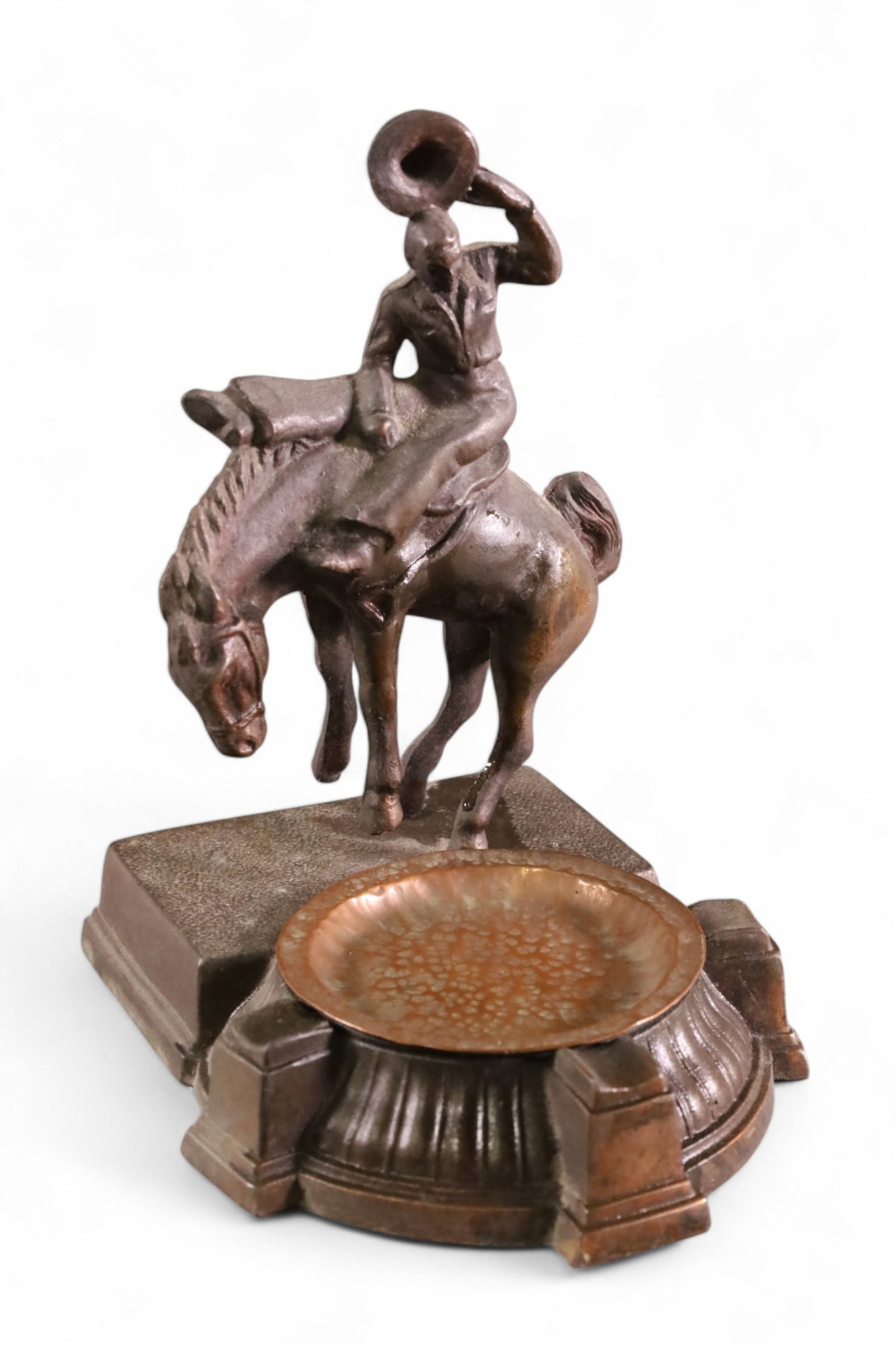 1940'S COWBOY FORM ASHTRAY: METAL AND COPPER COWBOY FORM ASHTRAY. 7 1/2" H.