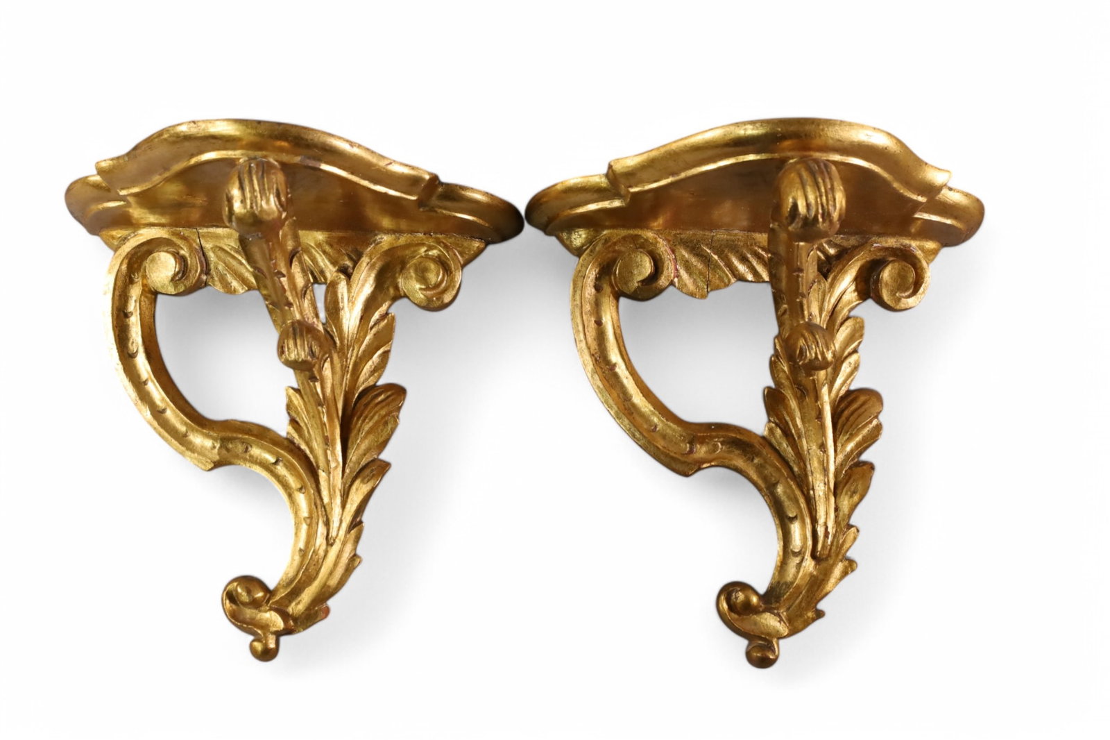 PAIR OF ITALIAN WALL SHELVES: PAIR OF CARVED ITALIAN WALL SHELVES, GOLD GILT FINISH. MARKED ITALY. 8 1/2" H x 9" W.