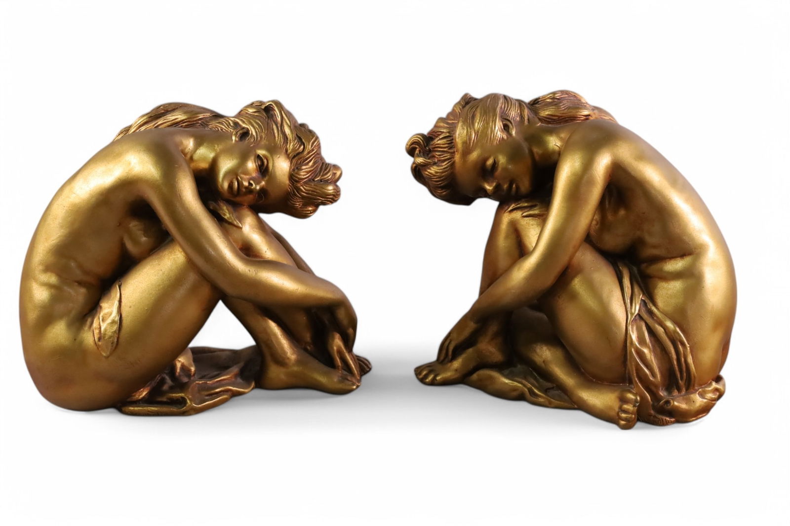 PAIR OF BOOKENDS: PAIR OF SEATED LADY FIGURE BOOKENDS, SIGNED MAROULTA. 8" H.