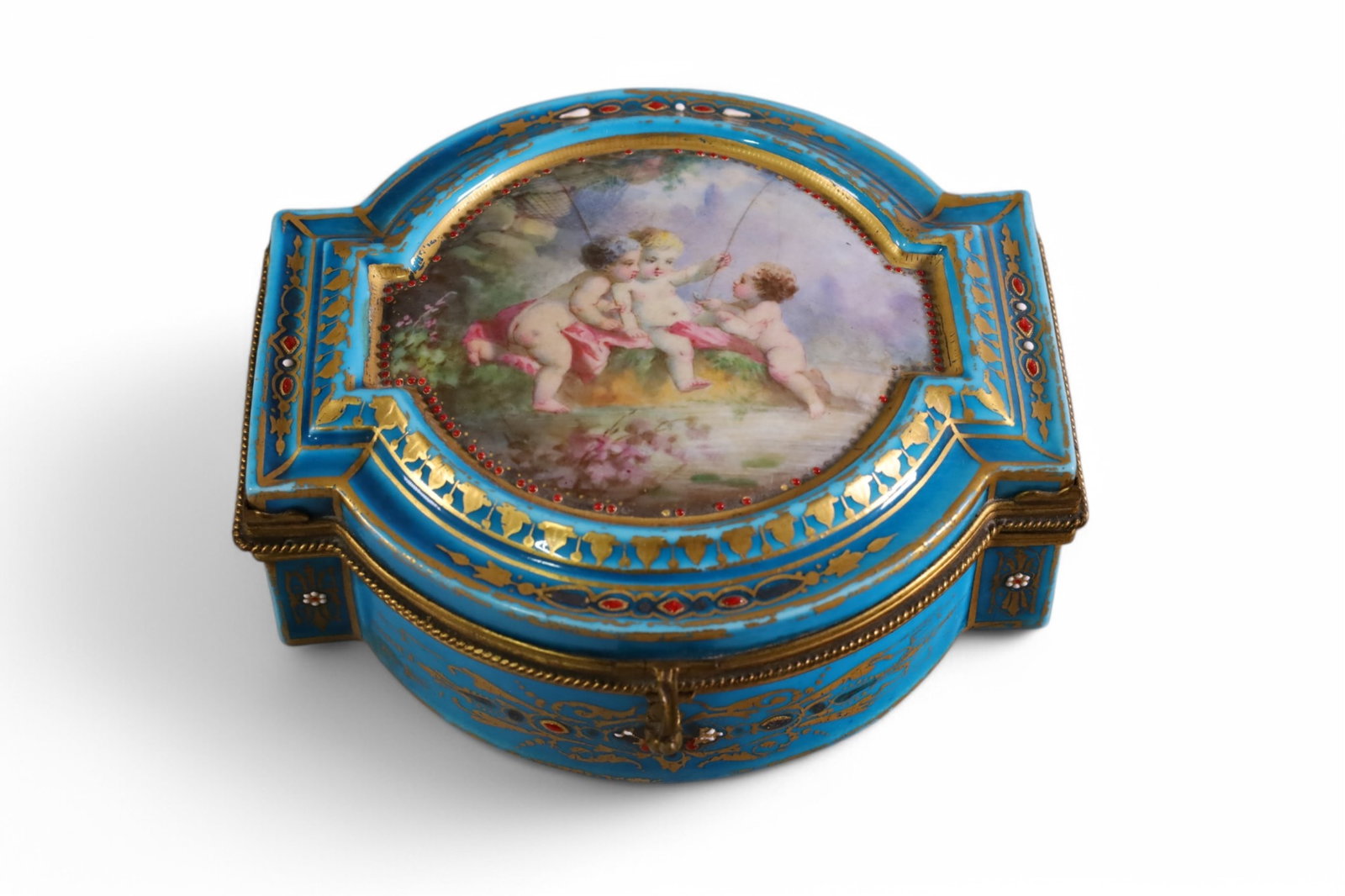 FRENCH DRESSER BOX: HAND PAINTED PORCELAIN FRENCH DRESSER BOX, CHERUB DESIGN. SCRATCHES AND PAINT LOSS. 5" W