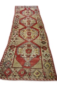 APPROX 10' 9" x 3' 10" HANDMADE WOOL RUG