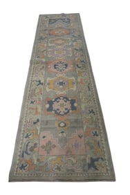 APPROX 10' 6" x 3' HANDMADE WOOL RUG