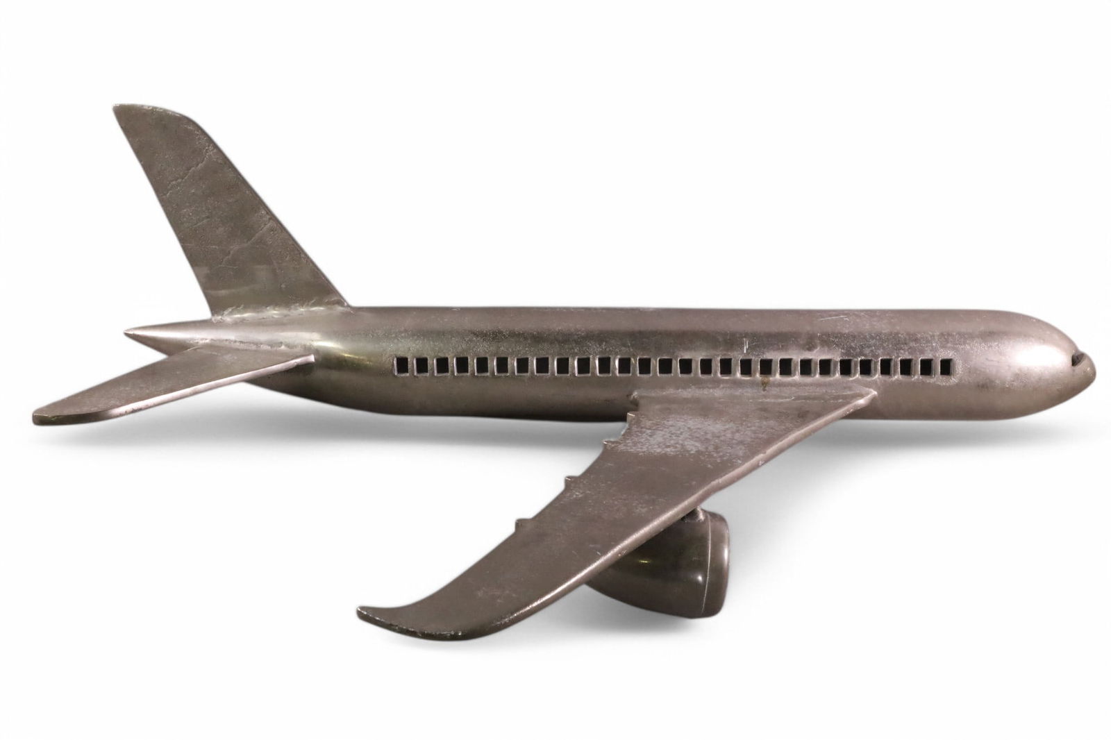 MODERN HANGING AIRPLANE MODEL: CAST METAL HALF AIRPLANE. 40" LONG X 20" WIDE. THIS ITEM EXCEEDS SIZE LIMITATIONS FOR IN HOUSE SHIPPING, MUST BE PICKED UP IN HOUSE OR SHIPPED VIA 3rd PARTY GROUND SHIPPER.