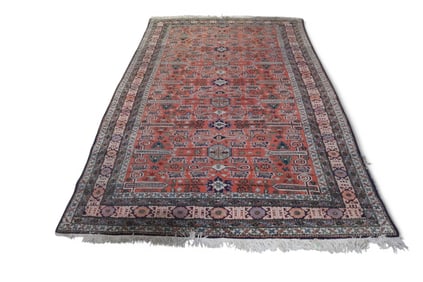 APPROX 8' 6" x 5' 7" HANDMADE WOOL RUG