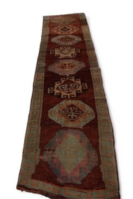 APPROX 11' 6" x 2' 10" HANDMADE WOOL RUG