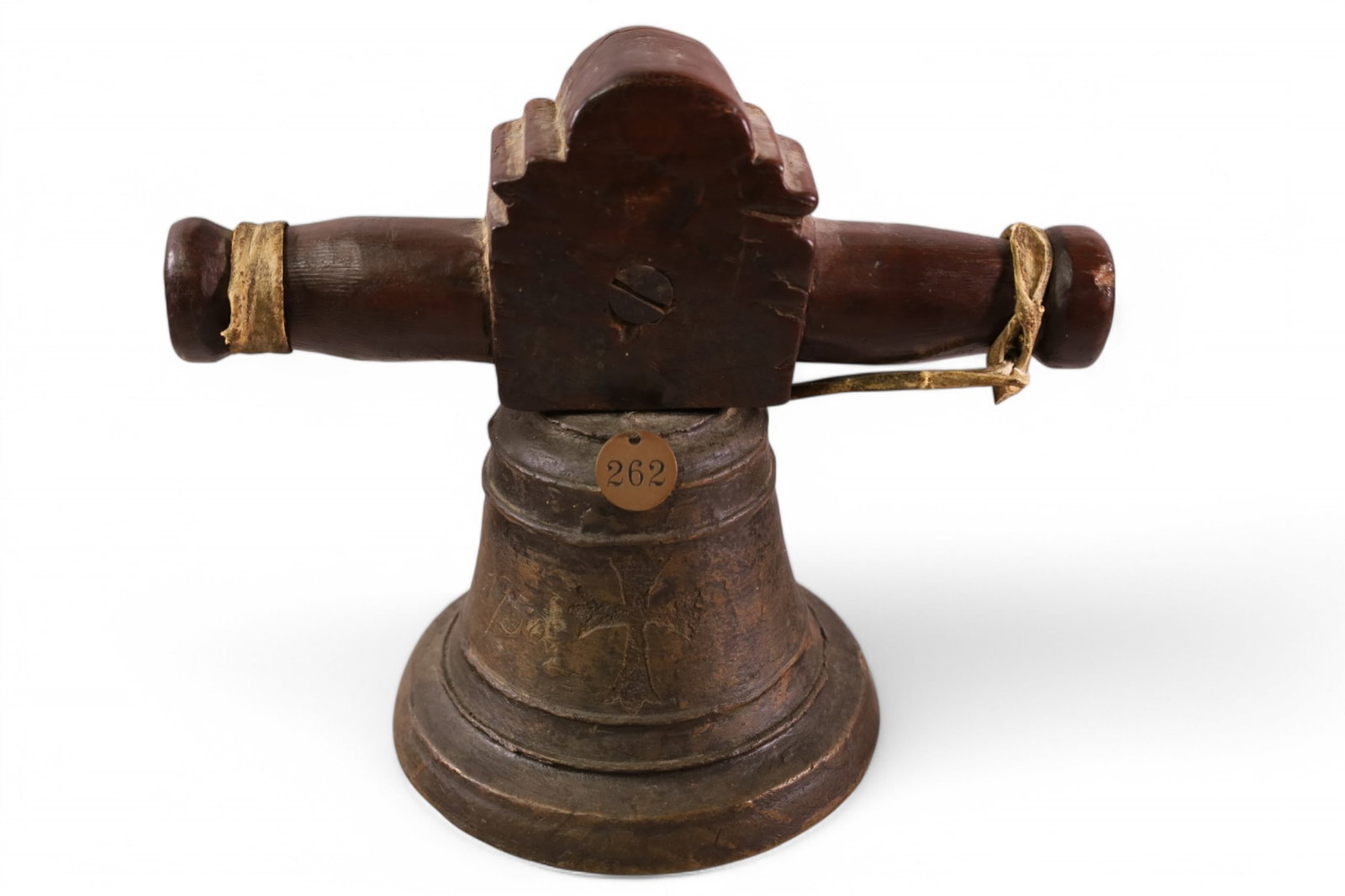 1750 ORDER OF ST. DOMINIC MISSION BELL: BRONZE SANCTUS BELL WITH DOUBLE WOODEN HANDLES. FROM ONE OF THE DOMICAN MISSIONS OF BAJA CALIFORNIA. HAS METAL TAG 262 FROM THE MISSION INN RIVERSIDE CALIFORNIA. 9" TALL X 6 1/2" DIAMETER