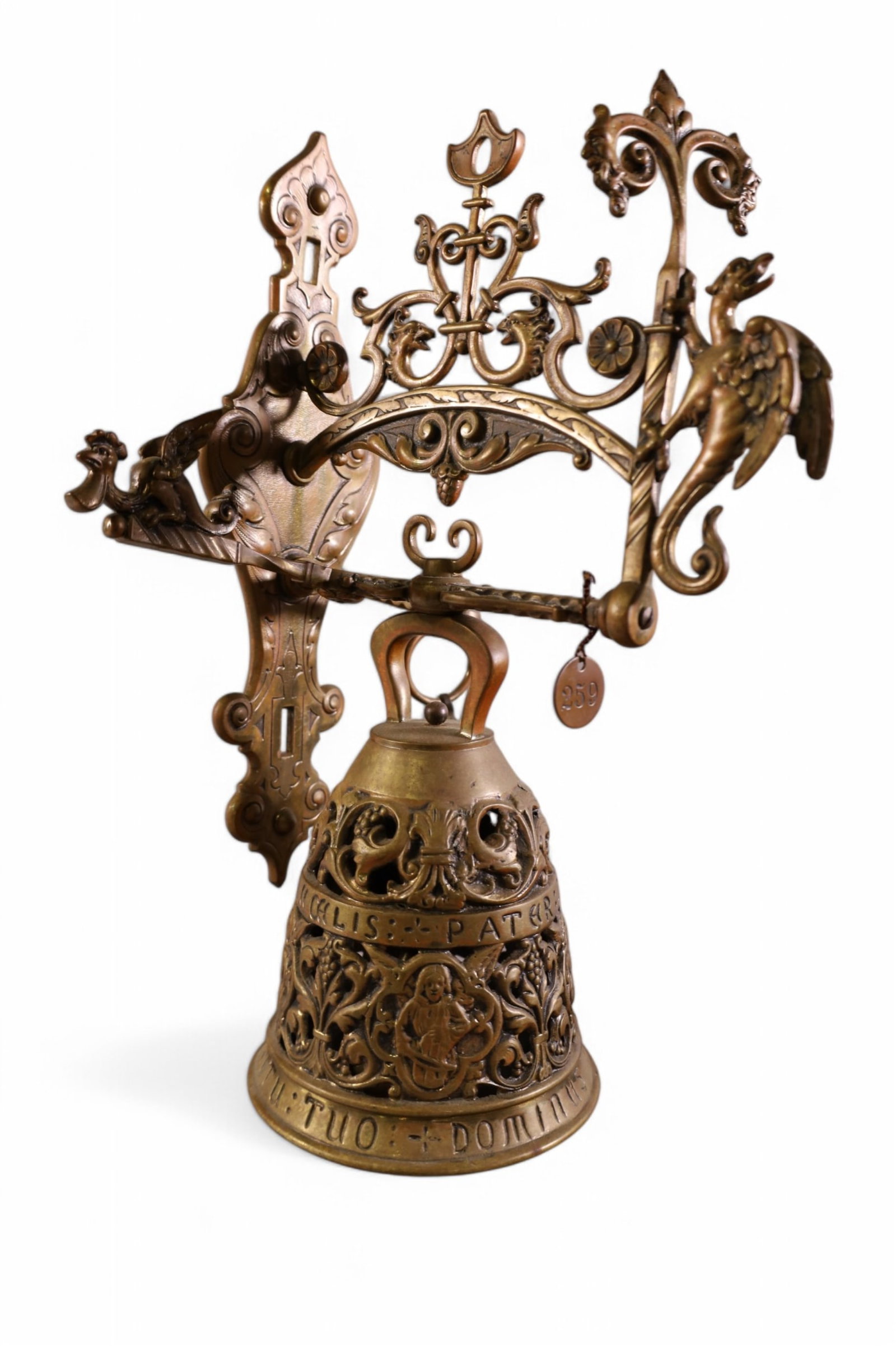 ST MARKS BELL WITH CHAIN & BRACKET: ST MARKS BELL WITH CHAIN AND BRACKET, ALL CARVED BRASS. HAS METAL TAG, 259 FROM MISSION INN RIVERSIDE CALIFORNIA. 14" H x 9" W.