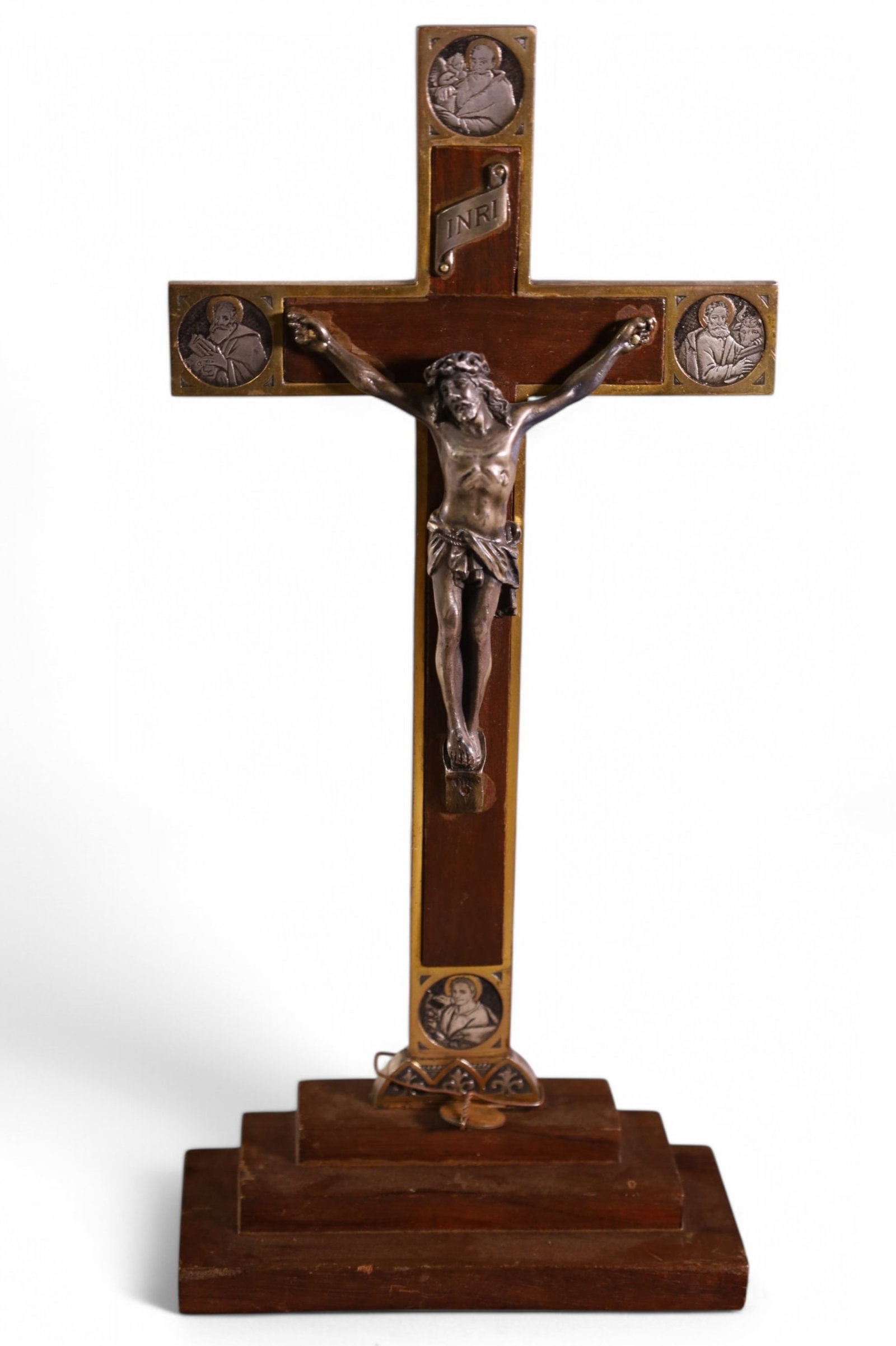 ANTIQUE CRUCIFIX: LARGE CRUCIFIX, SILVERED CORPUS WITH WOOD CROSS, MEDALLIONS OF SAINTS, MATTHEW, MARK, LUKE, AND JOHN. FROM SOUTH AMERICA. 9 1/2" H