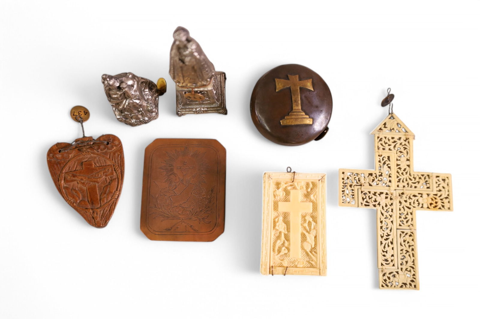 GROUPING OF MISC RELIGIOUS ITEMS: BONE CARVED CROSS BOX, HOLY OIL STOCK, (MARKED 204 FROM MISSION INN RIVERSIDE CA.) CARVED WOODEN CRUCIFIX PENDANT, BRASS MEDALLION. AND MORE.