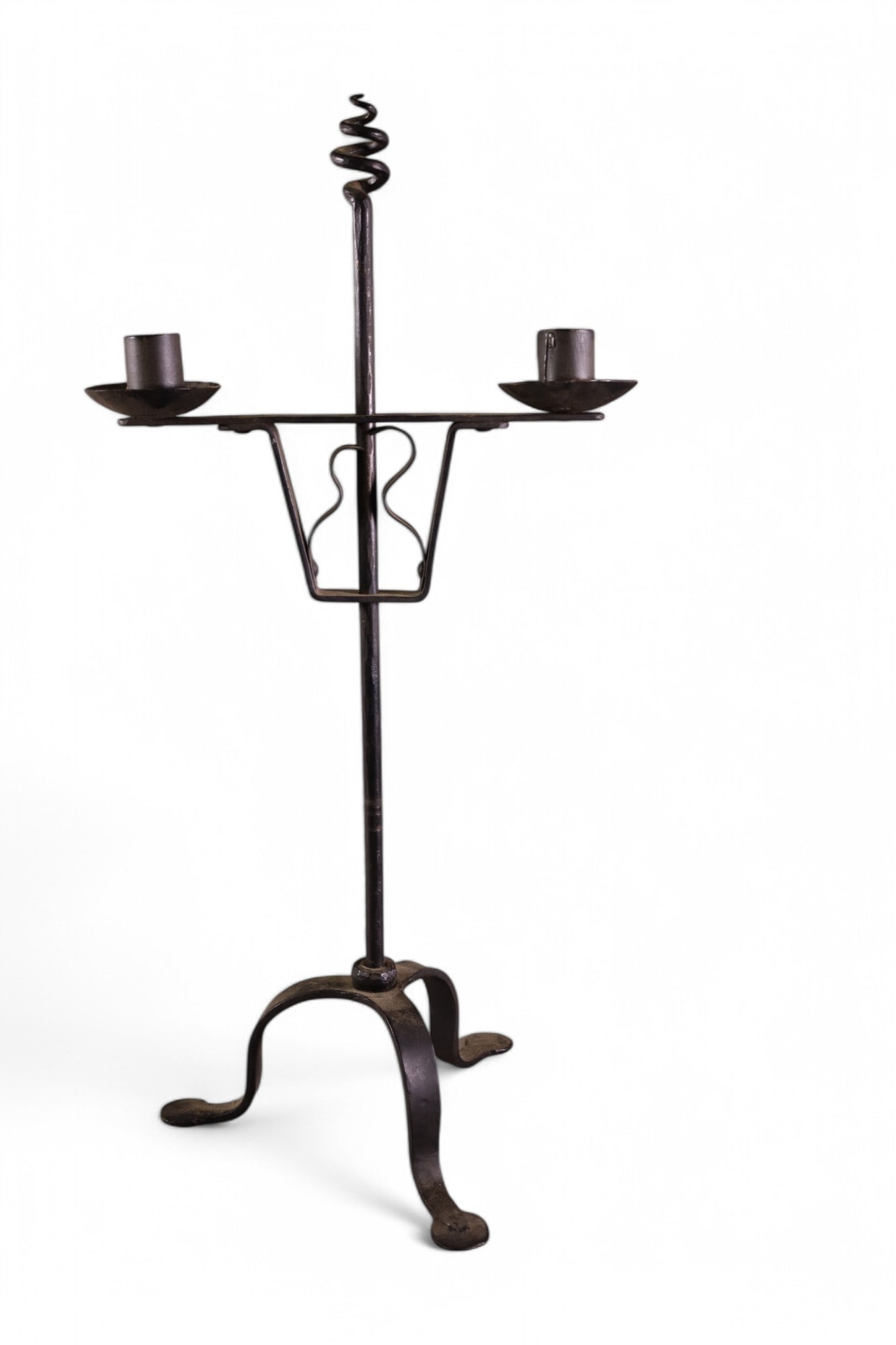 IRON CANDELABRA: ADJUSTABLE HEIGHT, DOUBLE ARM IRON CANDELABRA. 21" H. FROM THE COLLECTION OF THE MISSION INN RIVERSIDE CA.