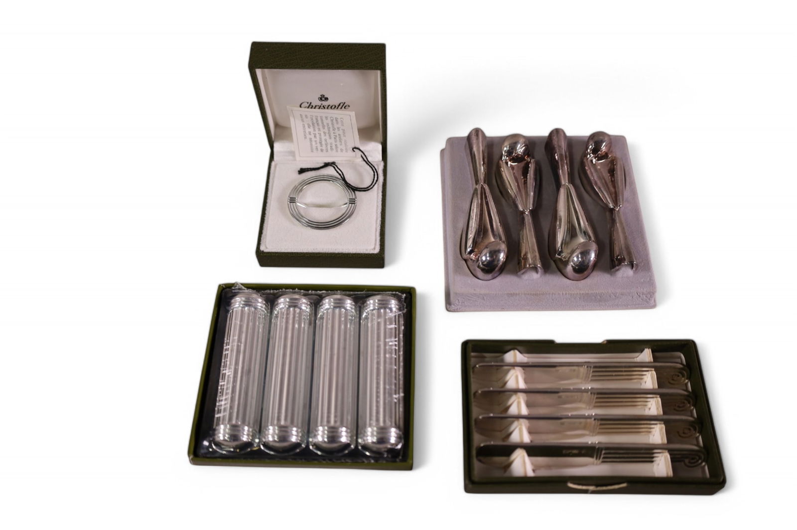 GROUPING OF CHRISTOFLE: 4 SMALL BUTTER KNIVES, BIRD FORM KNIFE RESTS, BUCKLE, AND MORE. WITH BOXES.