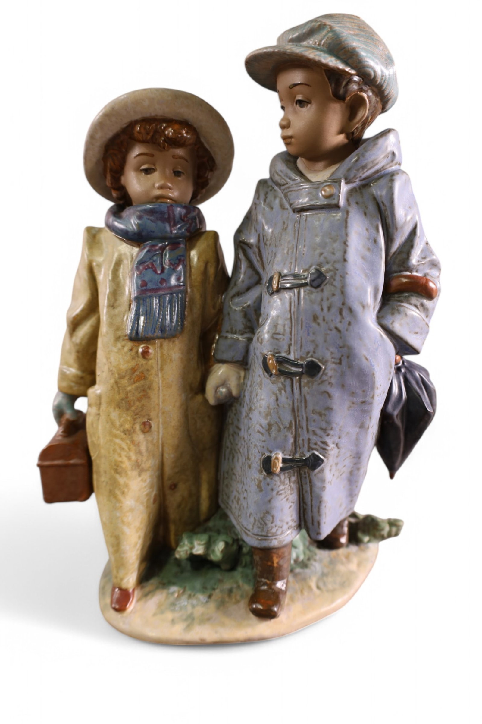LLADRO OFF TO SCHOOL FIGURE: LLADRO OFF TO SCHOOL FIGURE, No 12242, WITH BOX. 10 1/2" H.