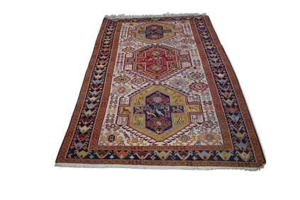 APPROX 4' 1" x 6' 7" HANDMADE WOOL RUG